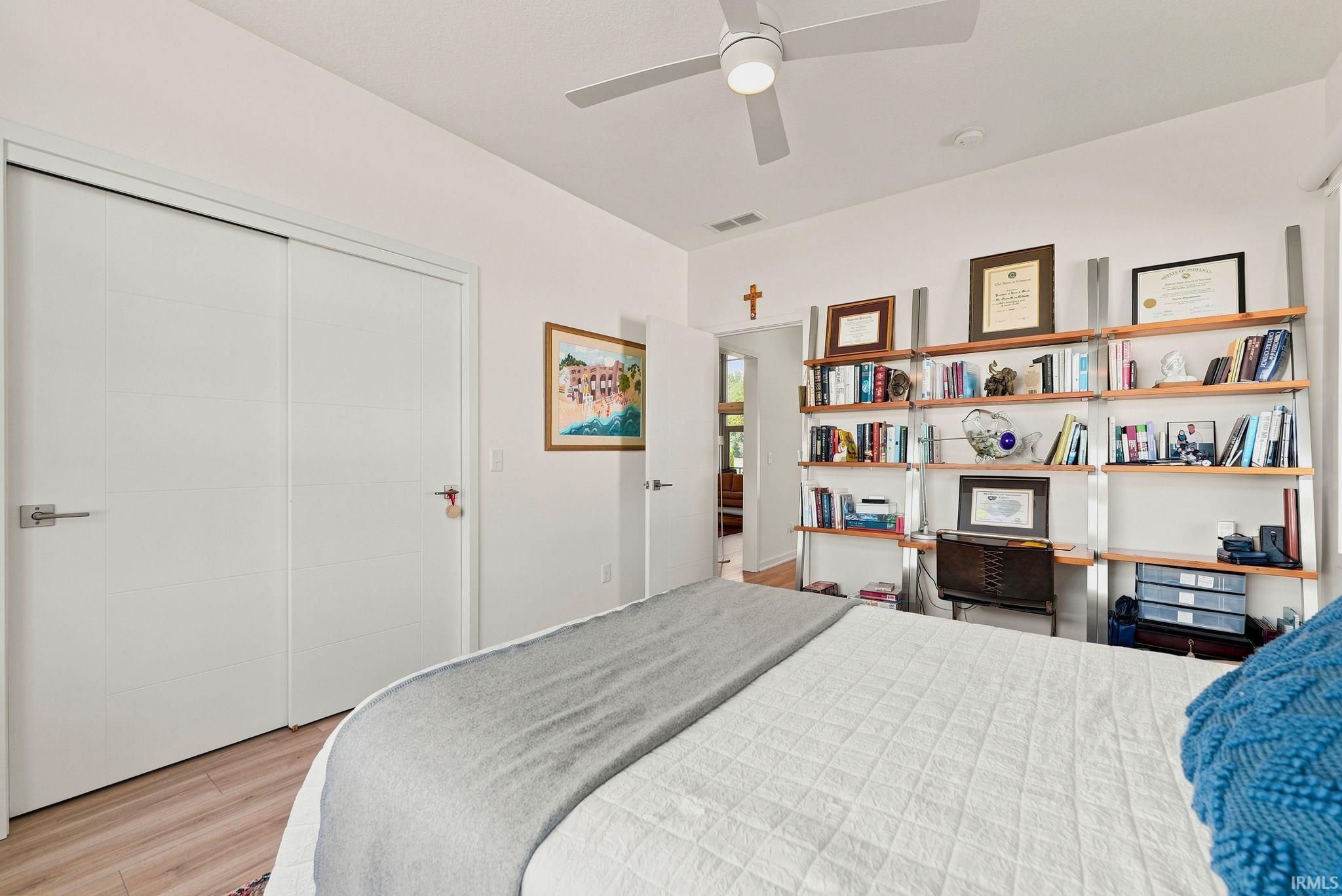 Interior space featuring wood-finish flooring and a contemporary ceiling fan