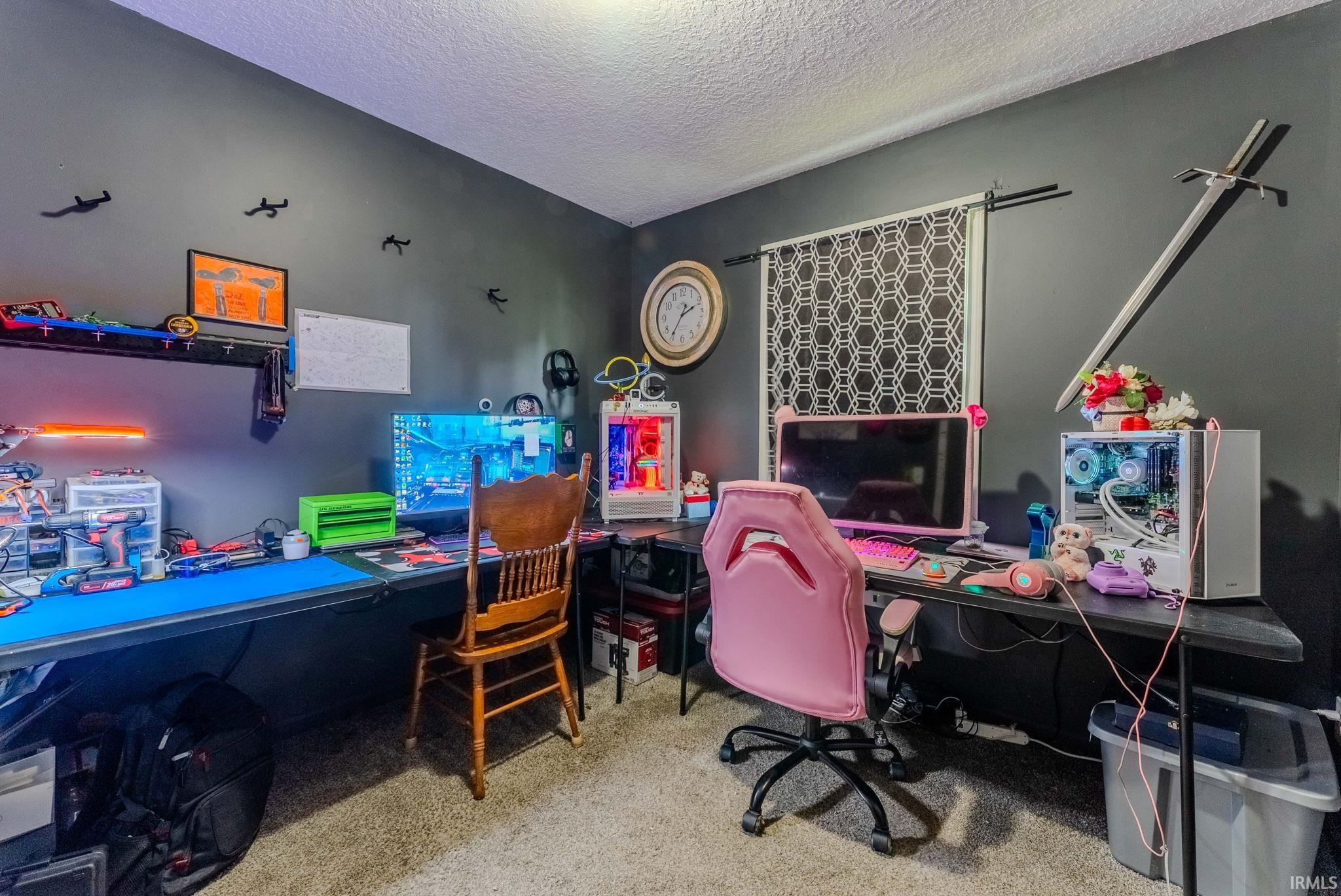 Dark-painted walls with textured ceiling