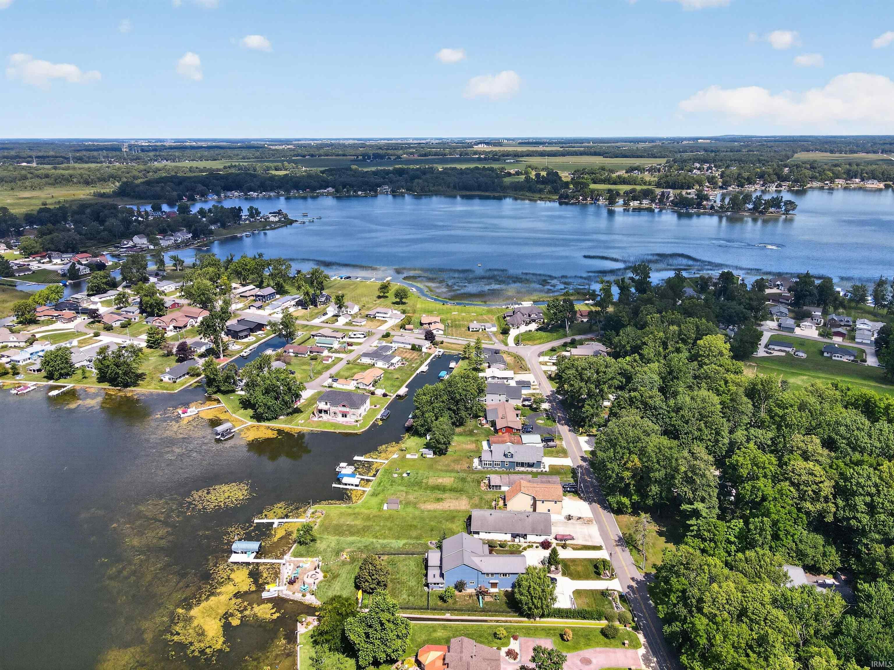 Expansive waterfront property featuring direct lake access, multiple private docks, and a residential community setting