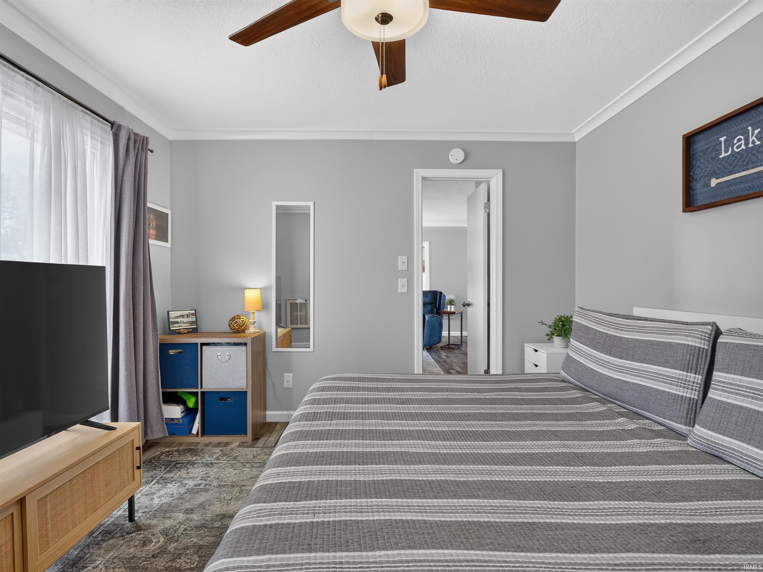 Interior room featuring light gray walls and white crown molding