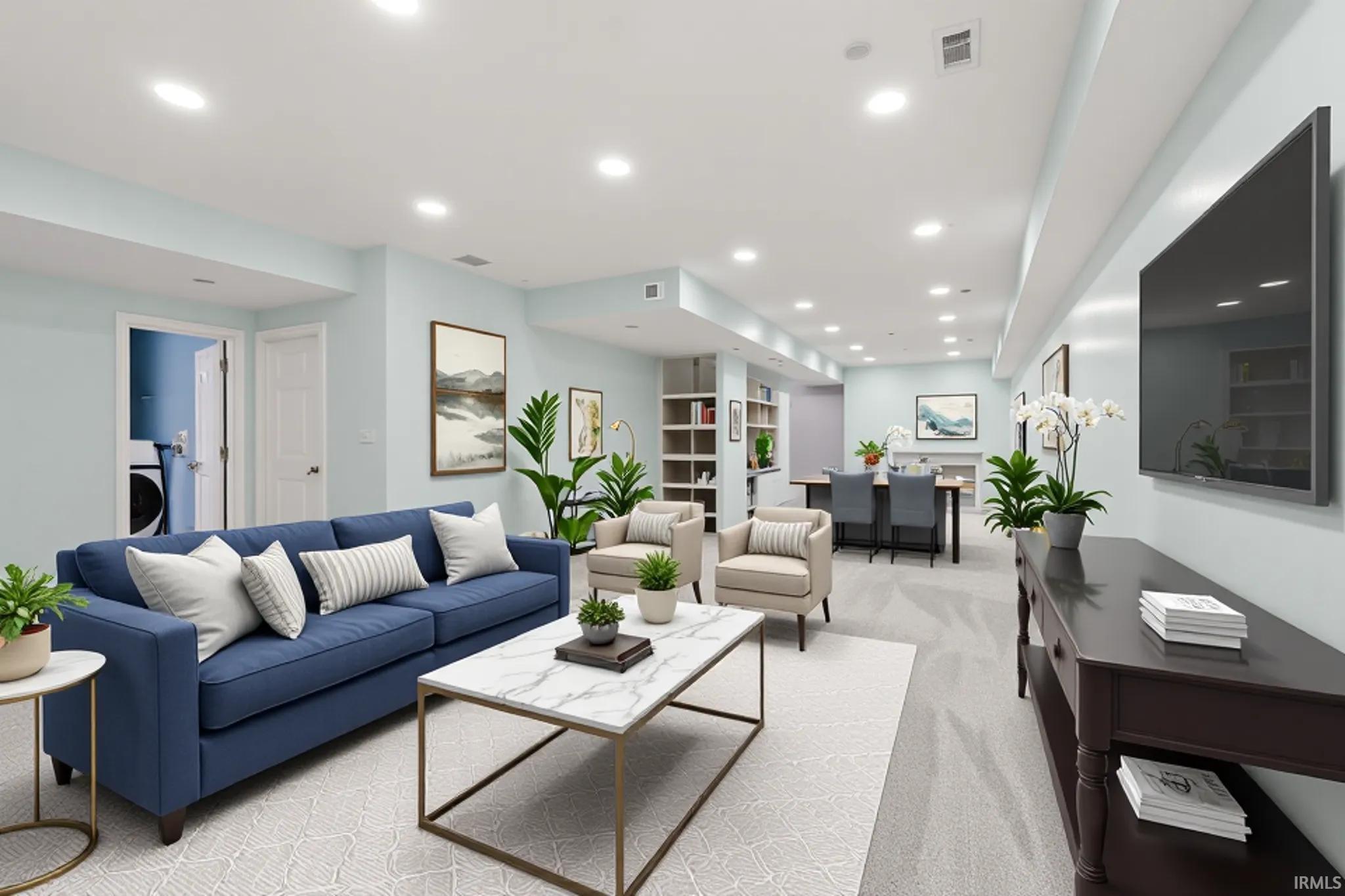 Recessed lighting illuminating a spacious open-concept area with light-toned wall paint