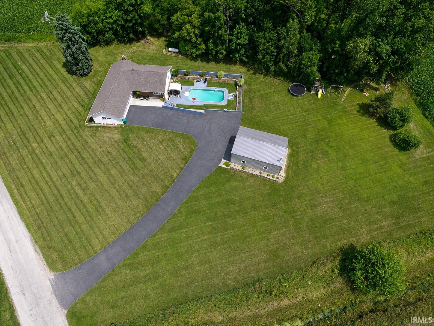 White single-story residence with a brown roof