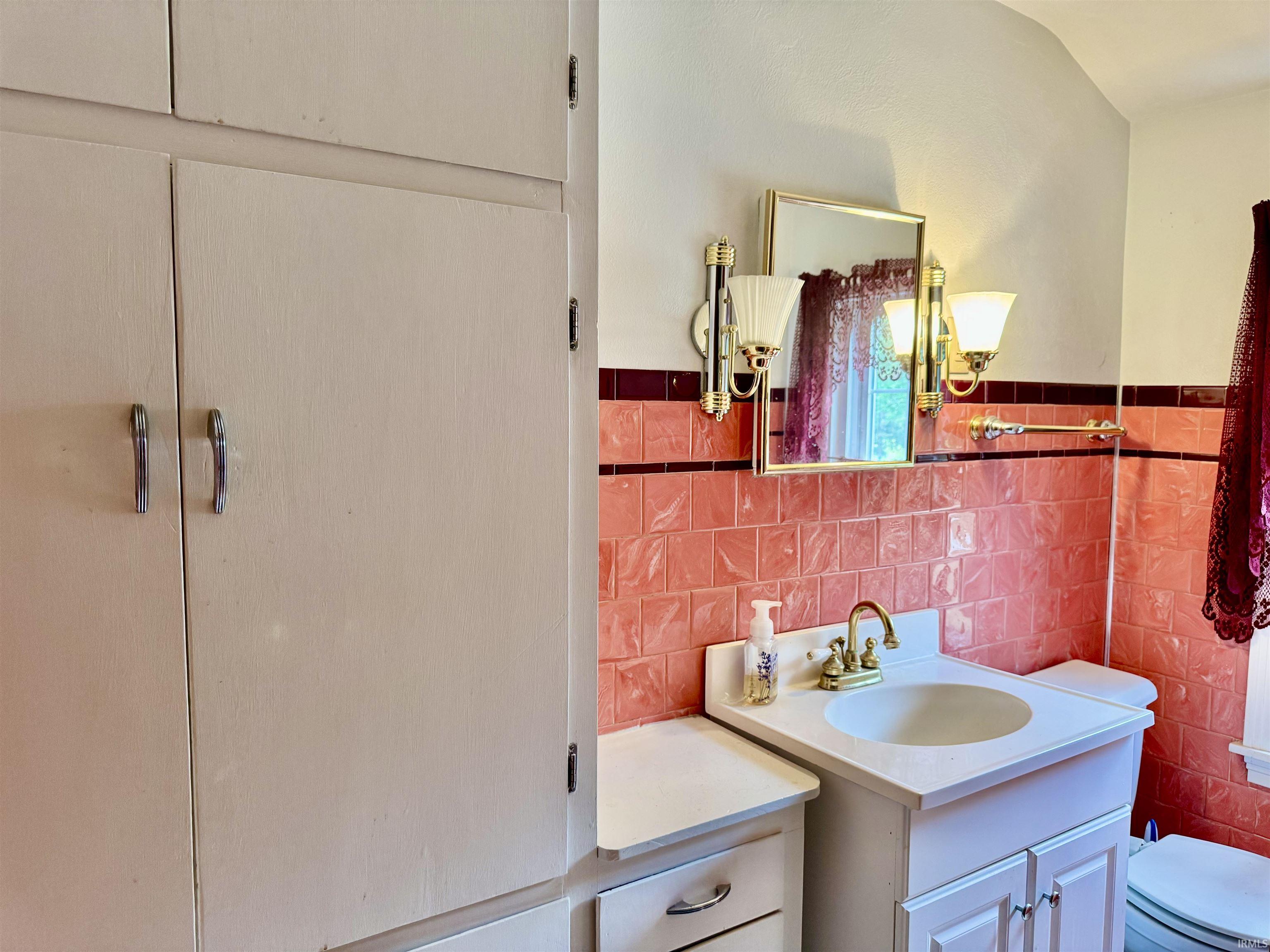Built-in storage cabinetry offering multiple compartments