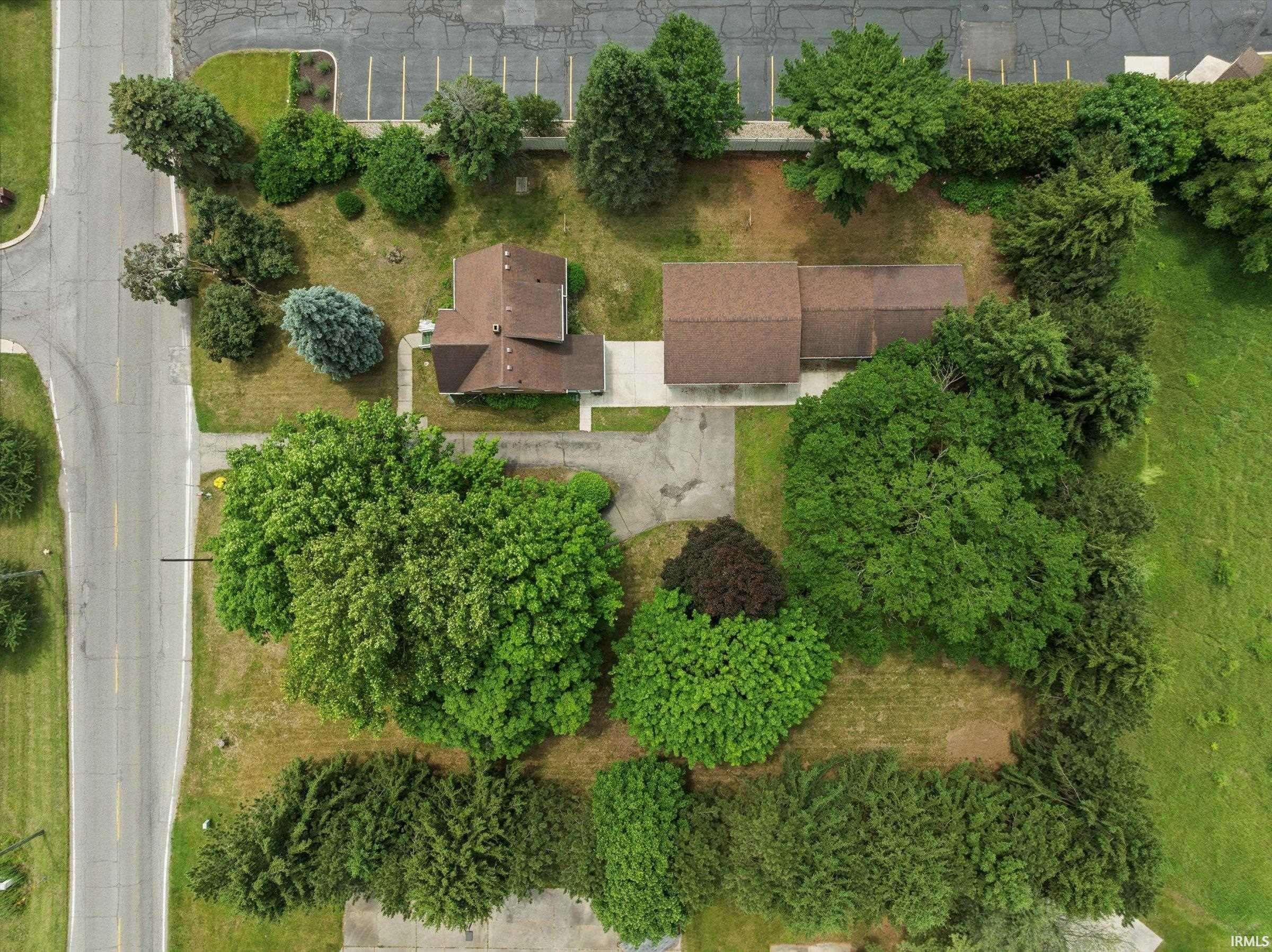 Expansive property with mature trees and established landscaping