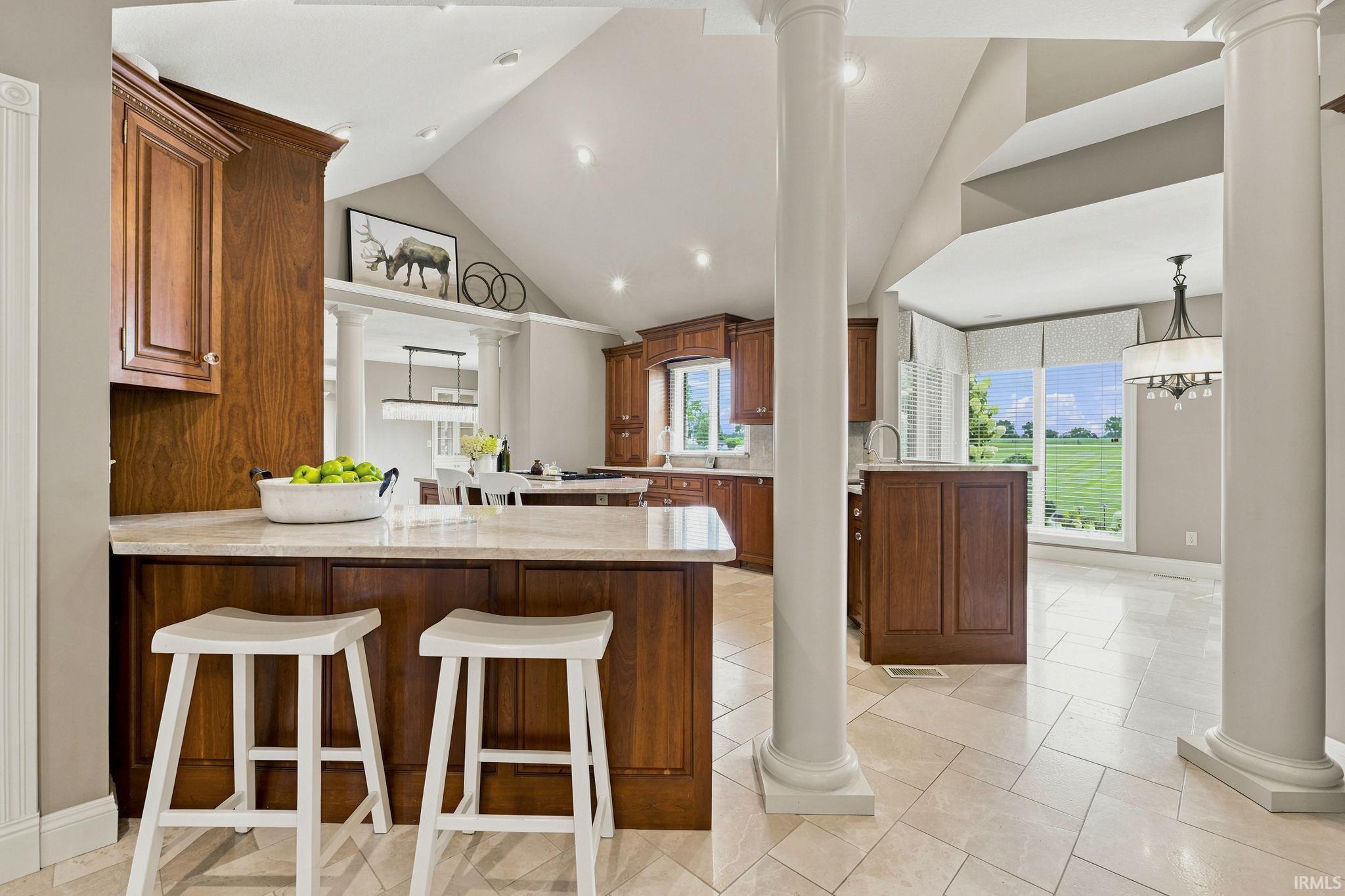 Gourmet kitchen featuring custom cabinetry and high end commercial appliances.