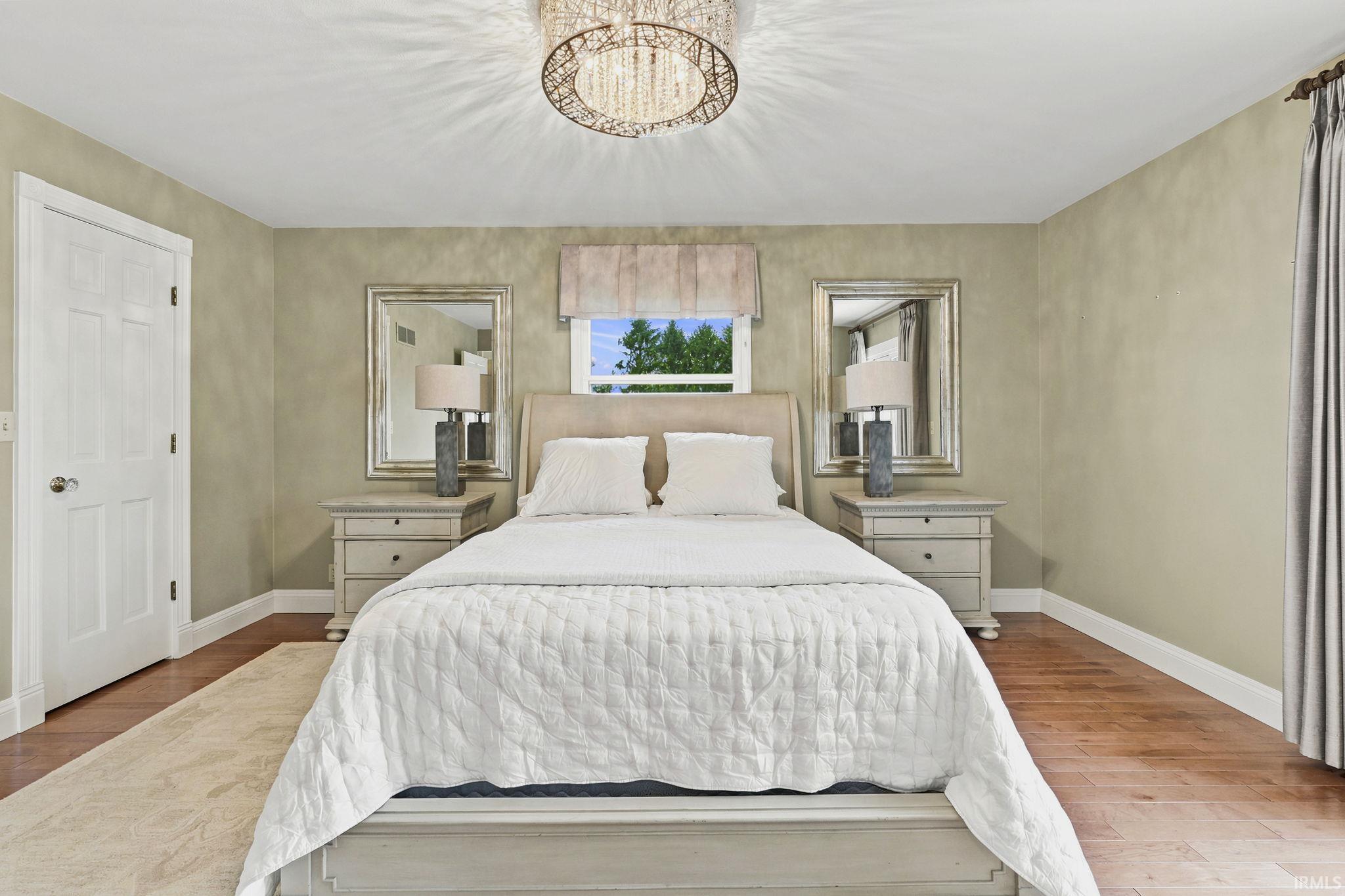 Two additional main-level bedrooms, including one with a private ensuite and another with convenient access to the hall bath.