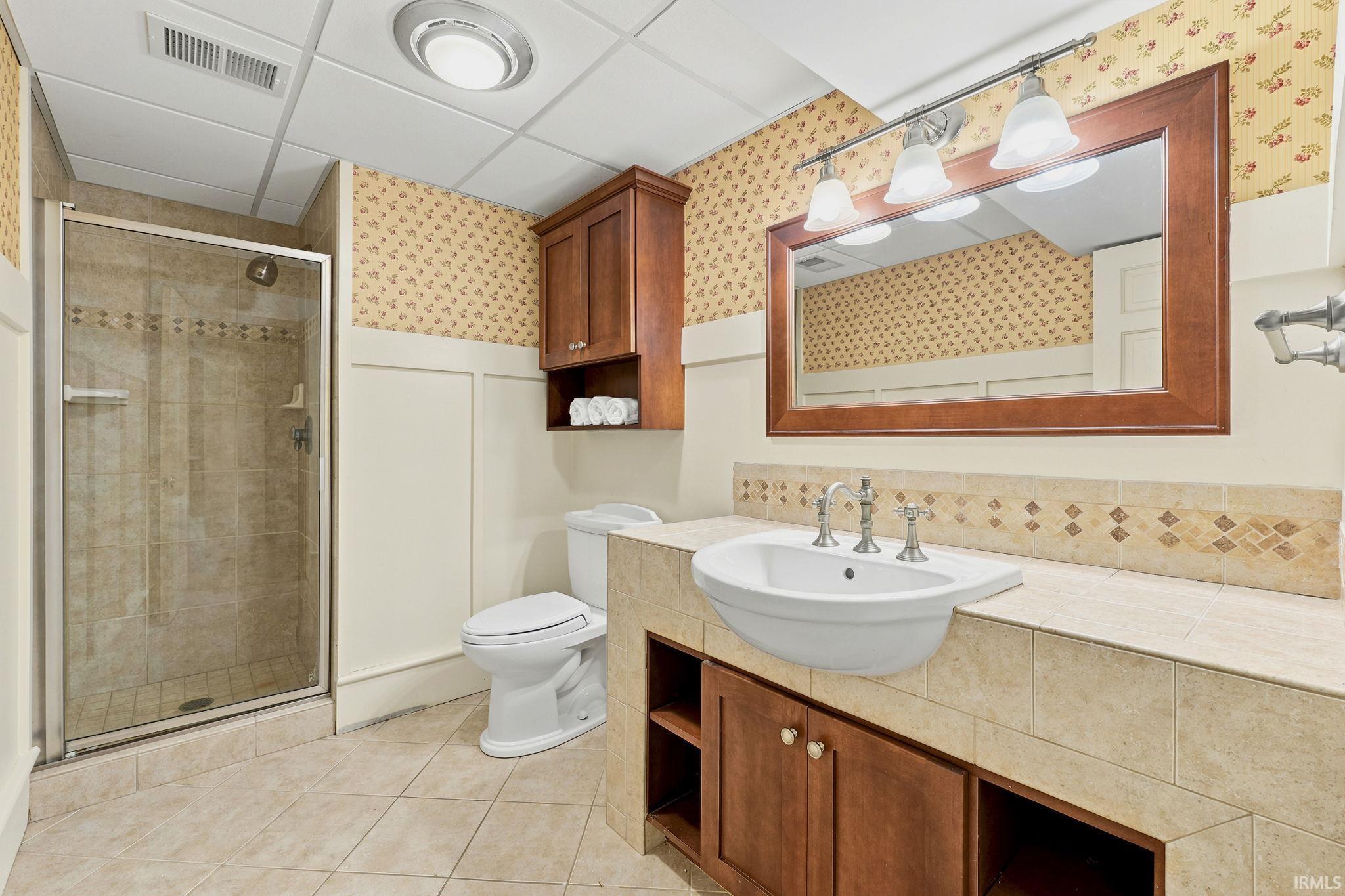Convenient lower-level bathroom with quality finishes and thoughtful design.