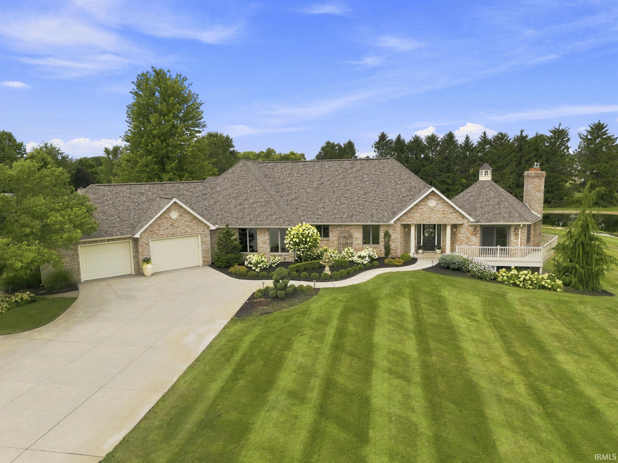Beautifully manicured grounds create exceptional curb appeal.