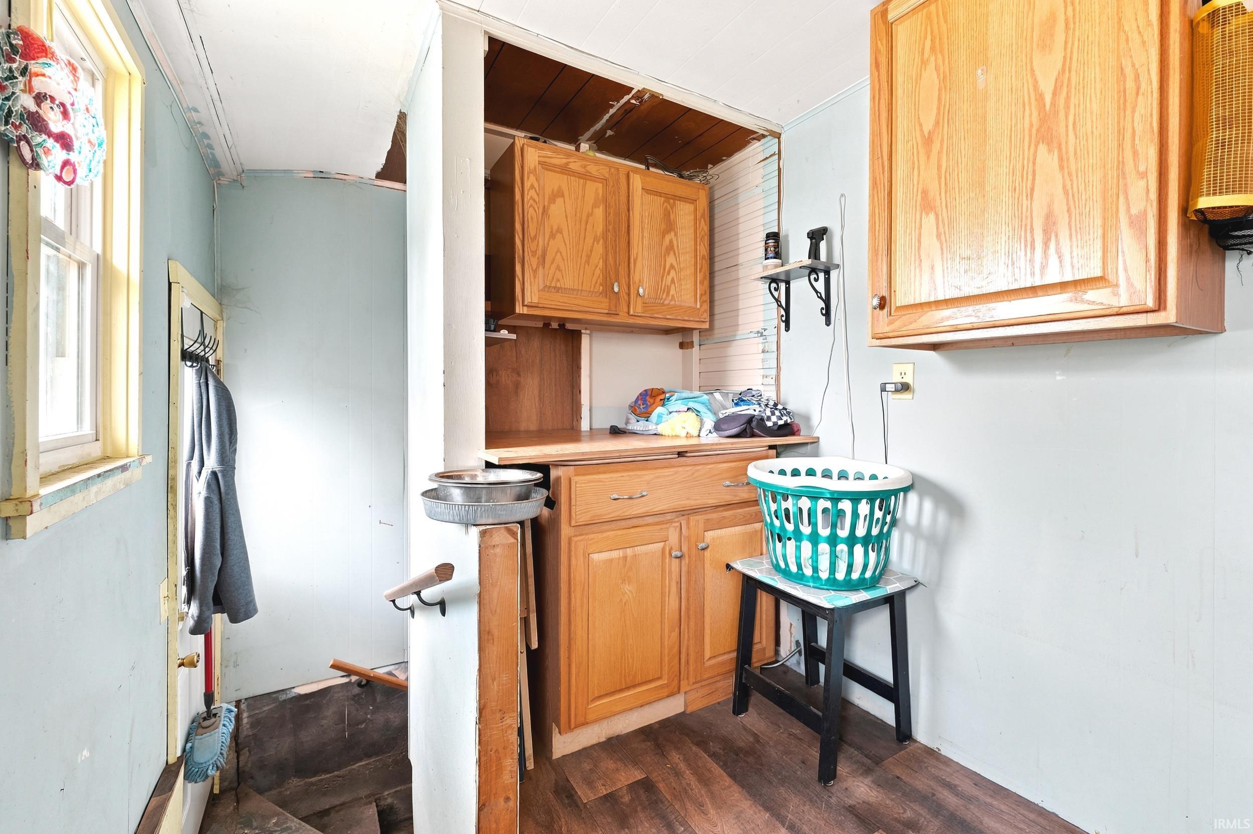 Wood-finish flooring with light blue walls