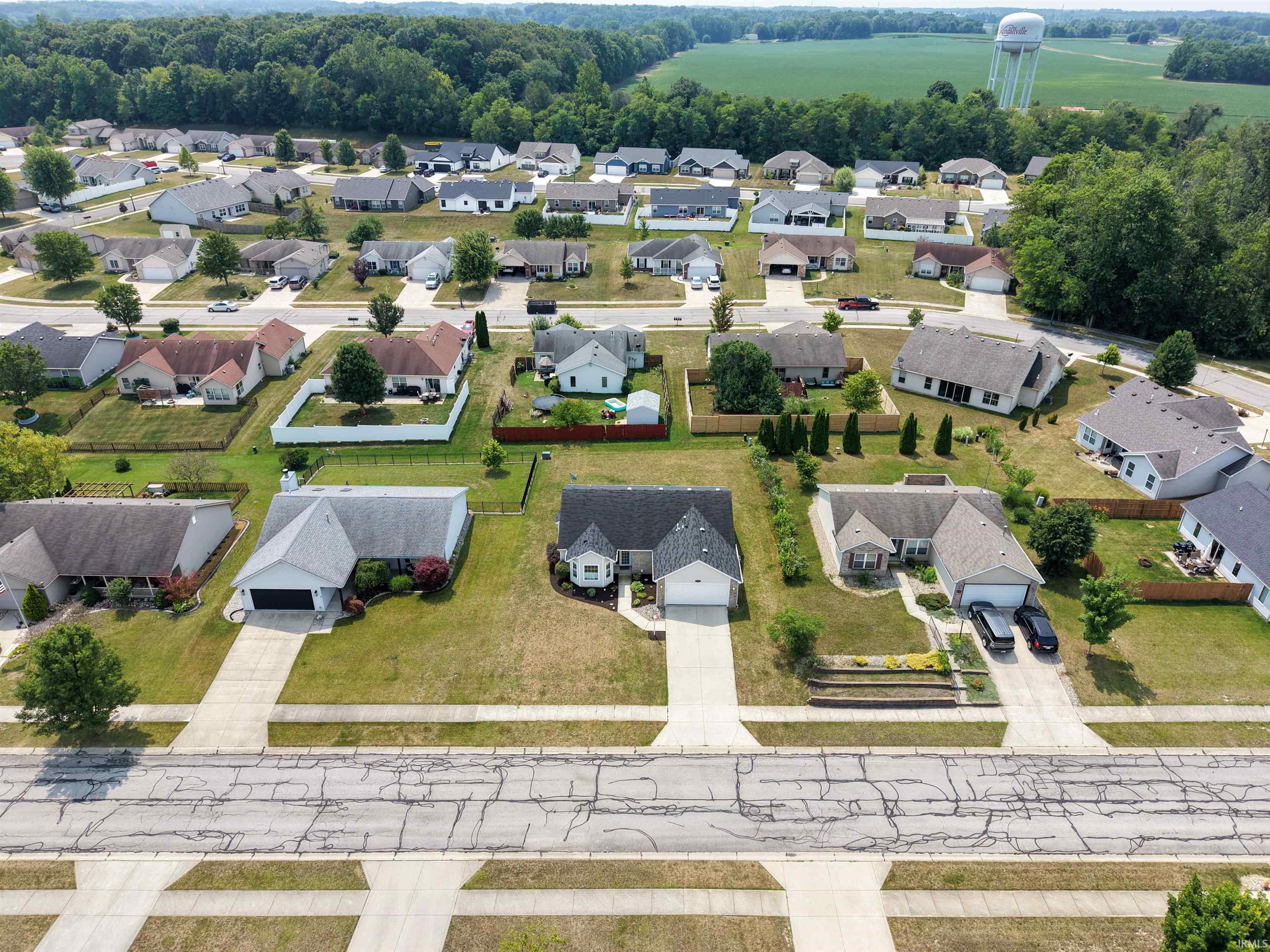 Aerial perspective showcasing a residential development with multiple single-story homes