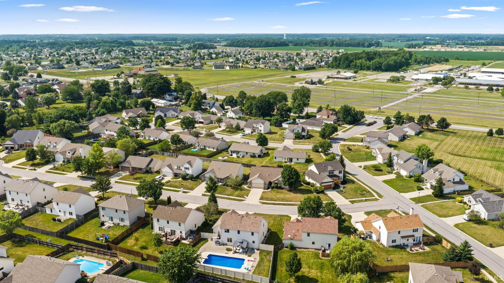 Aerial overview of a residential neighborhood with varied architectural styles