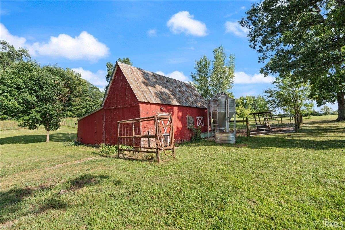 Red barn with a weathered tin roof