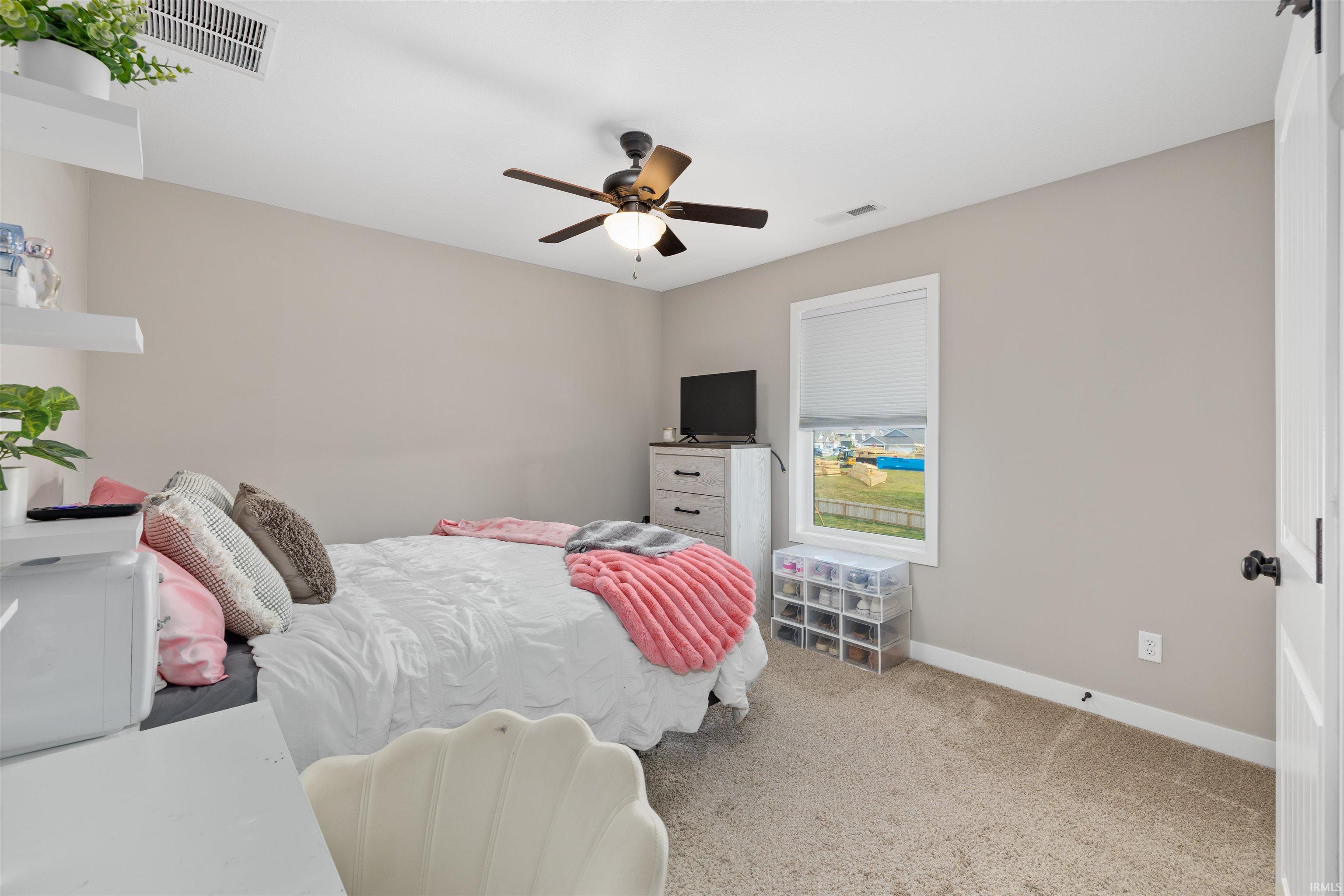 Neutral tone walls with carpeting and white trim