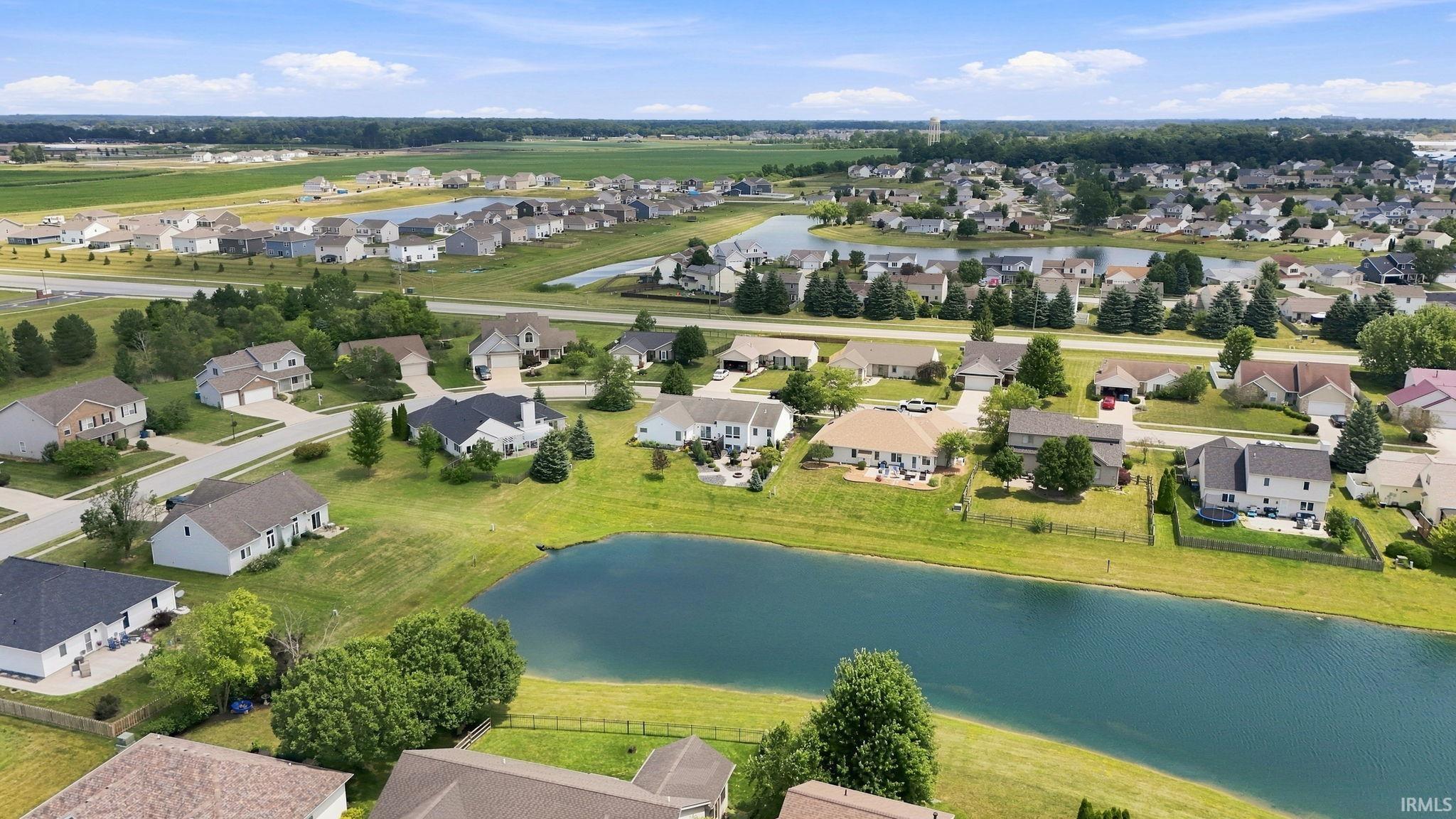 Aerial perspective showcasing a residential community with numerous homes