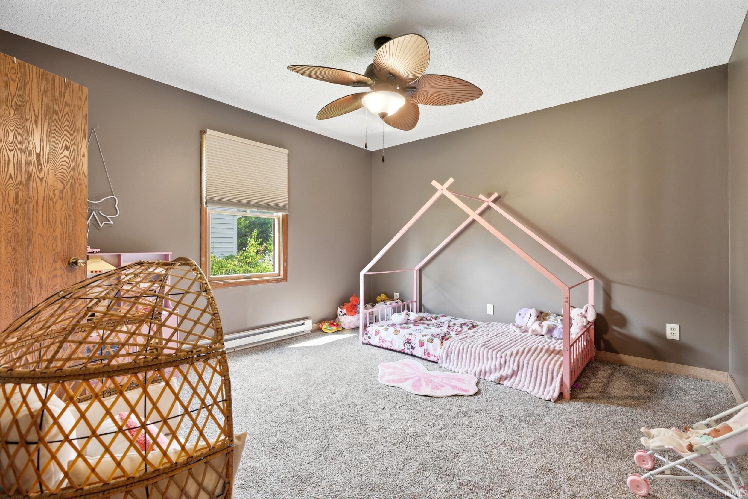 Neutral-toned walls and grey carpet flooring