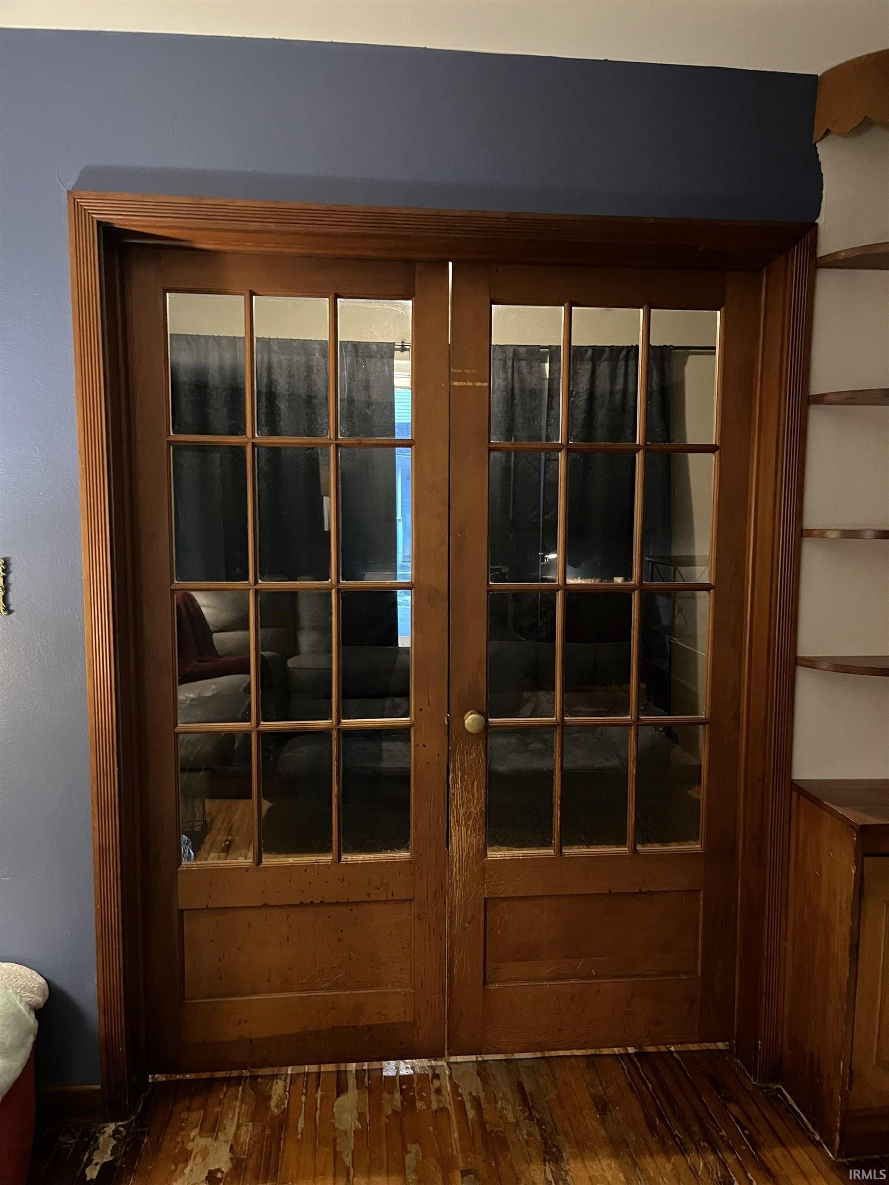 Double French doors with wood-finish frames and glass panels