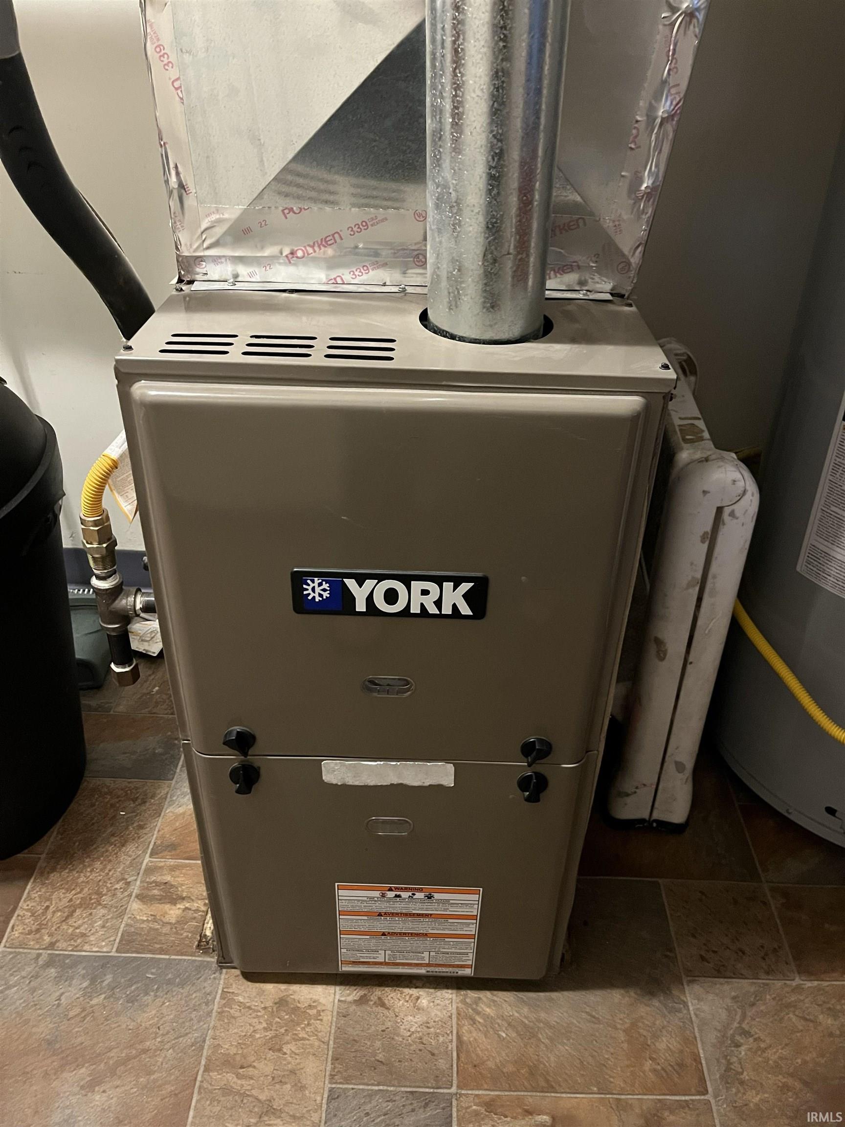York brand furnace unit with associated ductwork and gas line