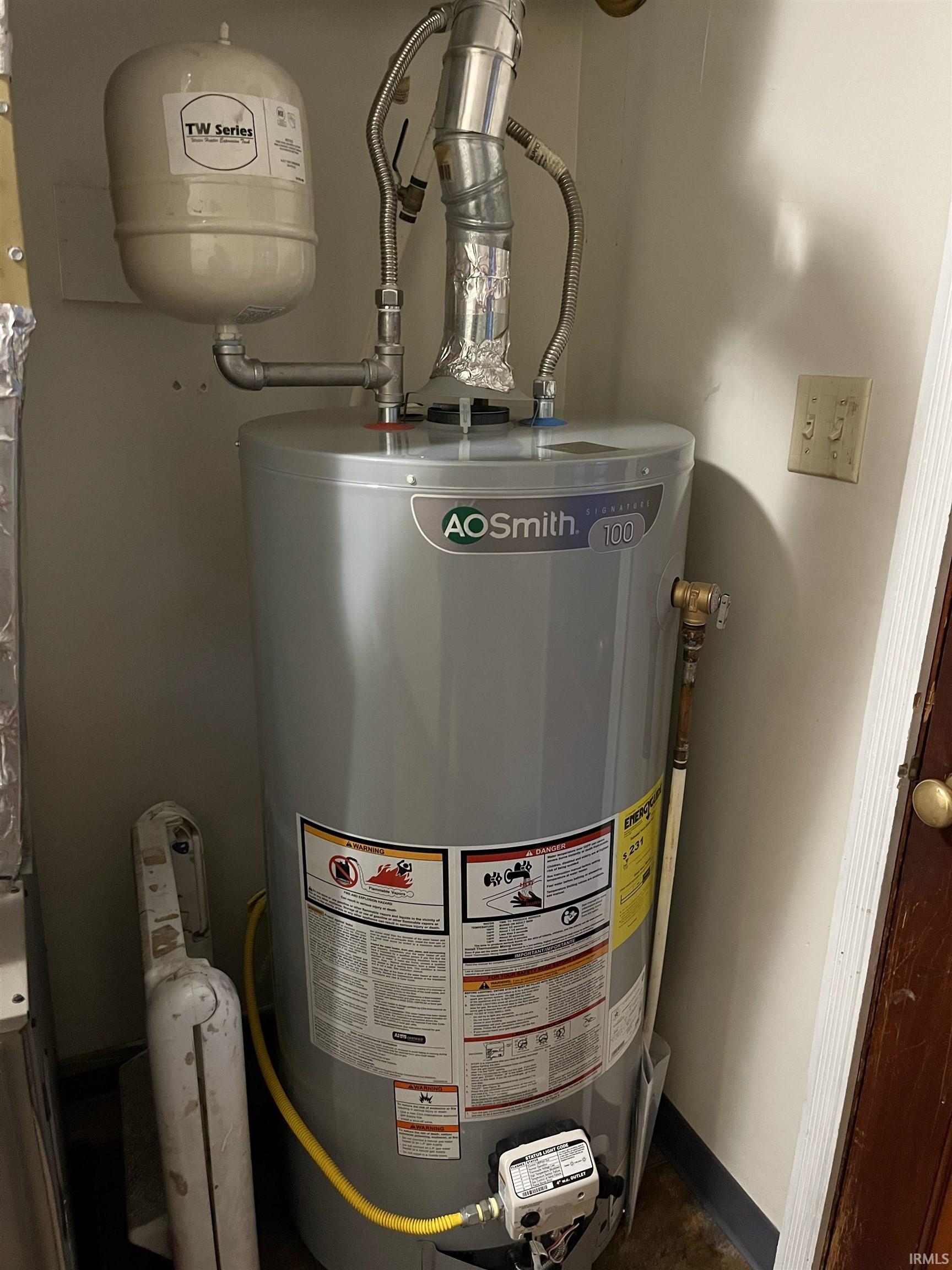 AO Smith water heater with attached expansion tank and flexible gas line