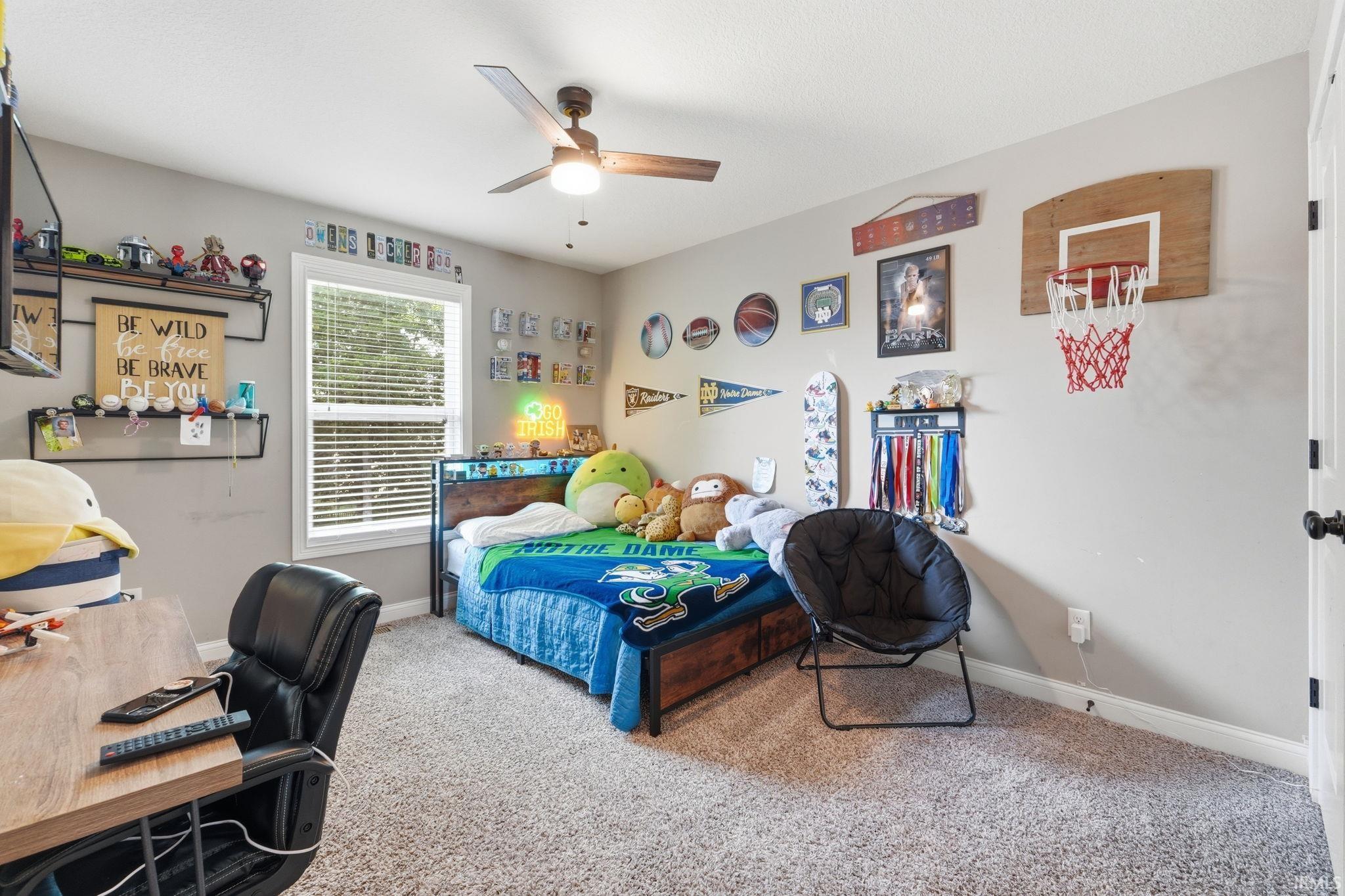 Neutral-toned walls complement the light-colored carpet flooring
