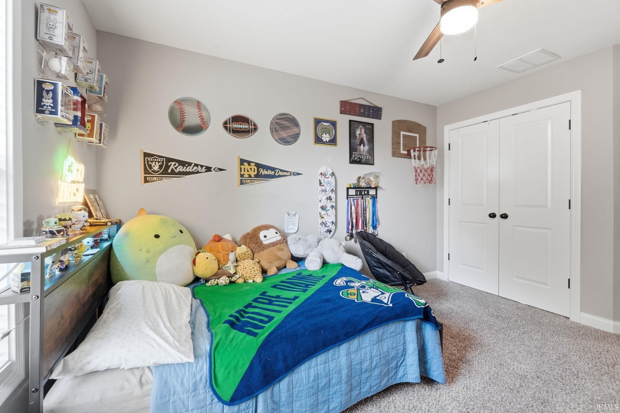 Neutral gray walls complement the light gray carpet flooring