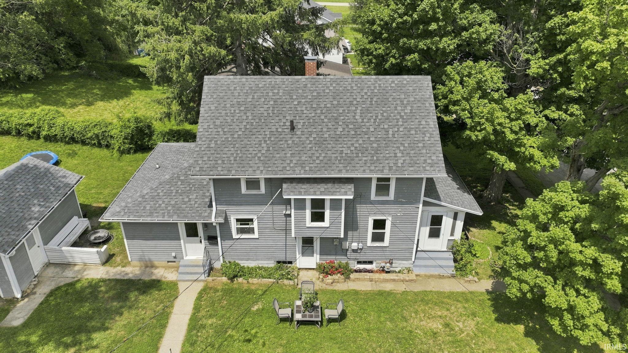 Gray siding exterior with white trim and a gray shingle roof