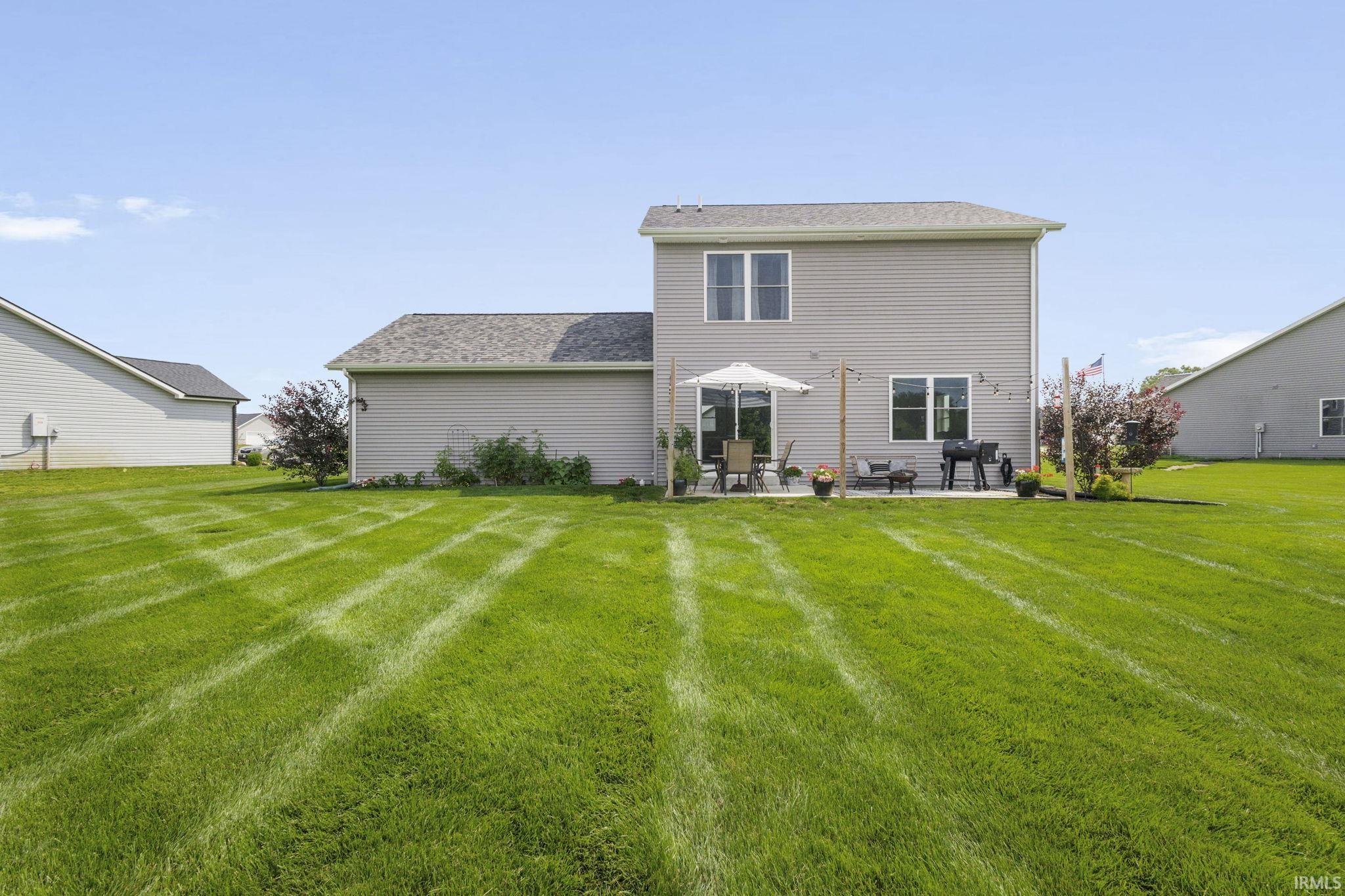 Expansive green lawn providing ample outdoor space