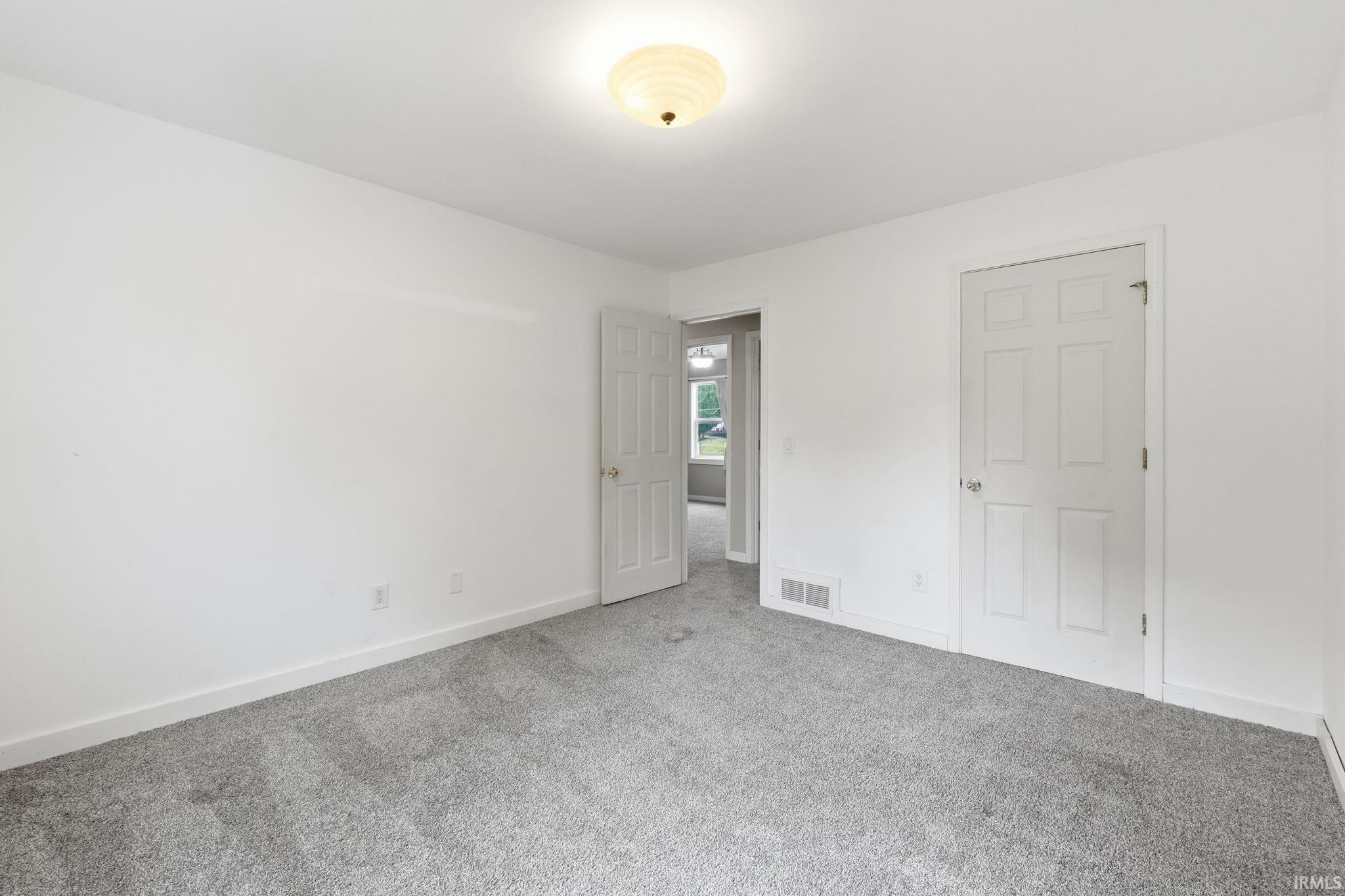Neutral color palette with light gray carpeting