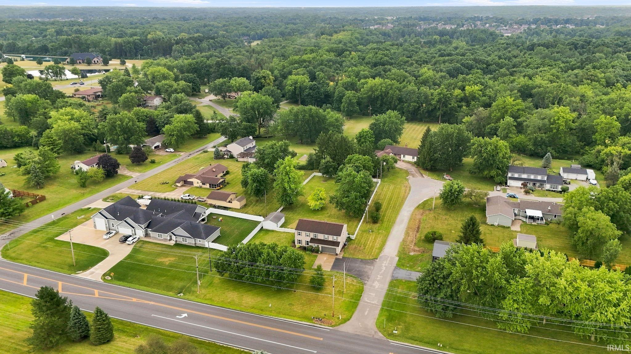 Expansive residential property with a multi-gabled roofline and attached garage