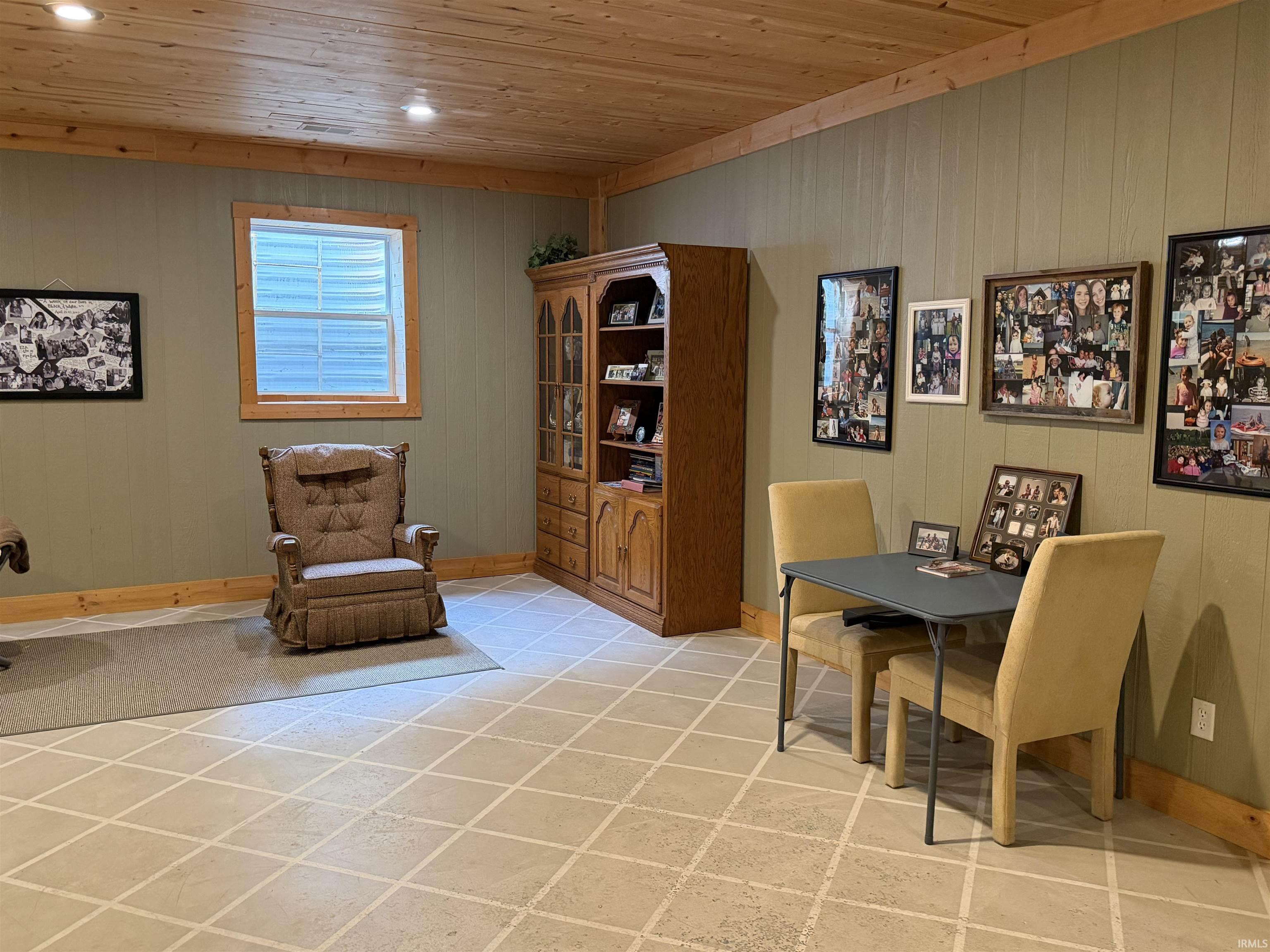 Wood-paneled ceiling with recessed lighting