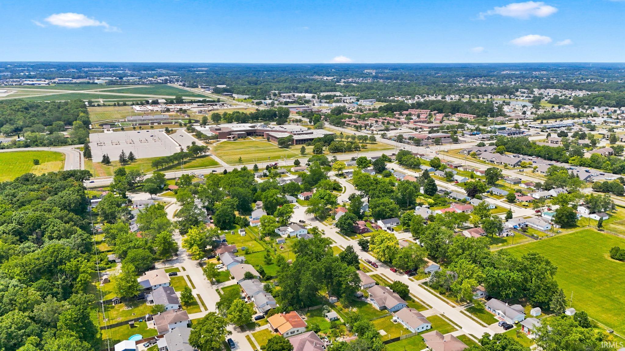 Aerial perspective of a residential neighborhood with detached homes