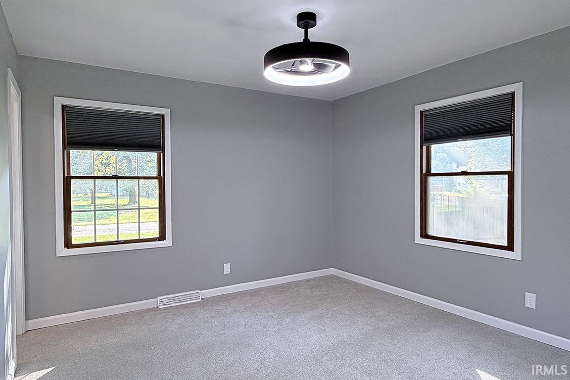 Light gray walls complemented by white baseboards and window trim