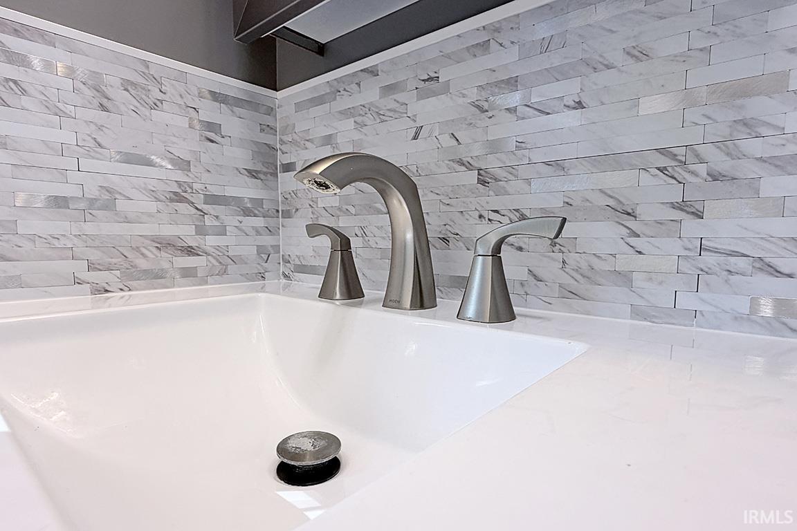 White rectangular under-mount sink with a coordinating white countertop