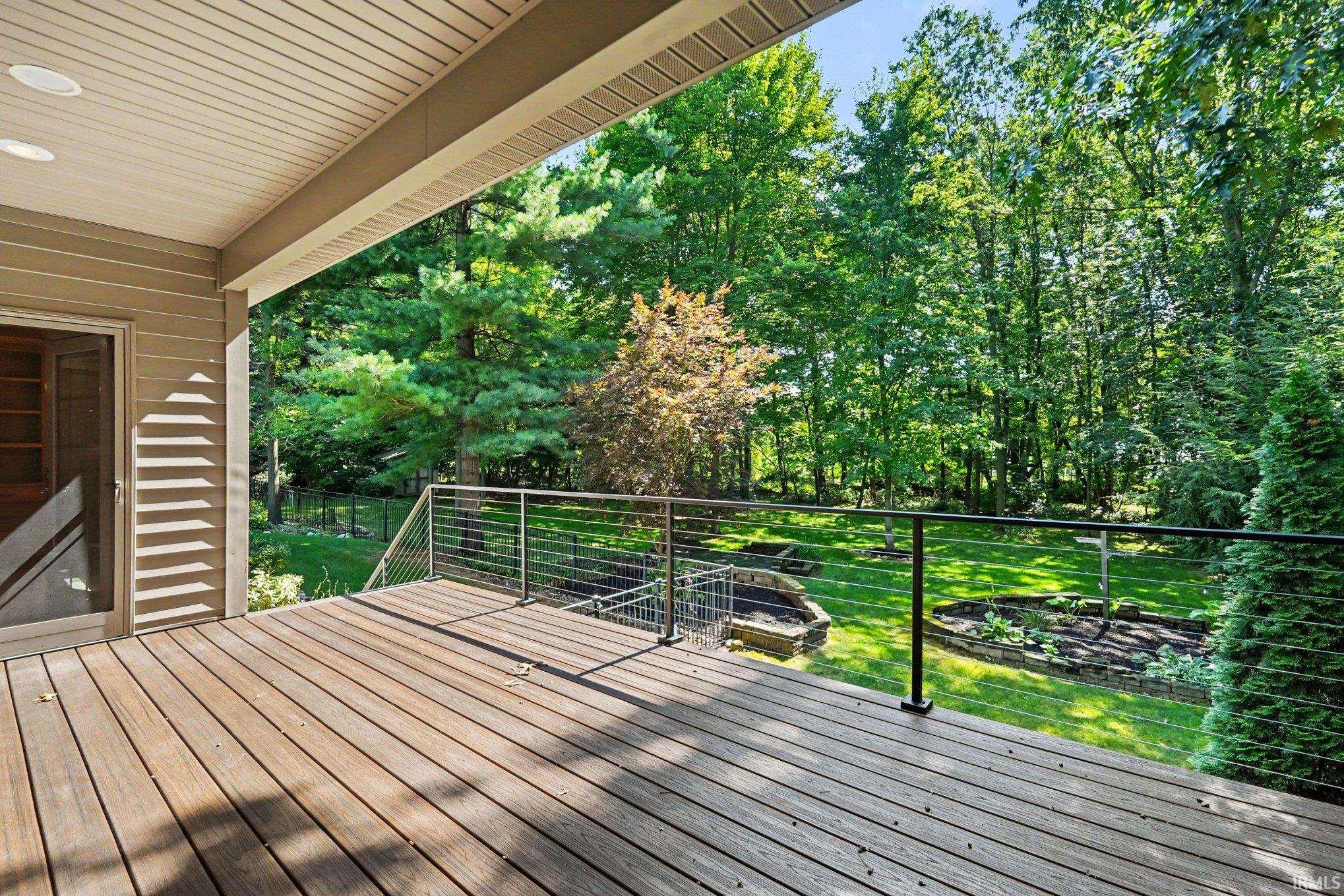 New deck partially covered with modern cable railings