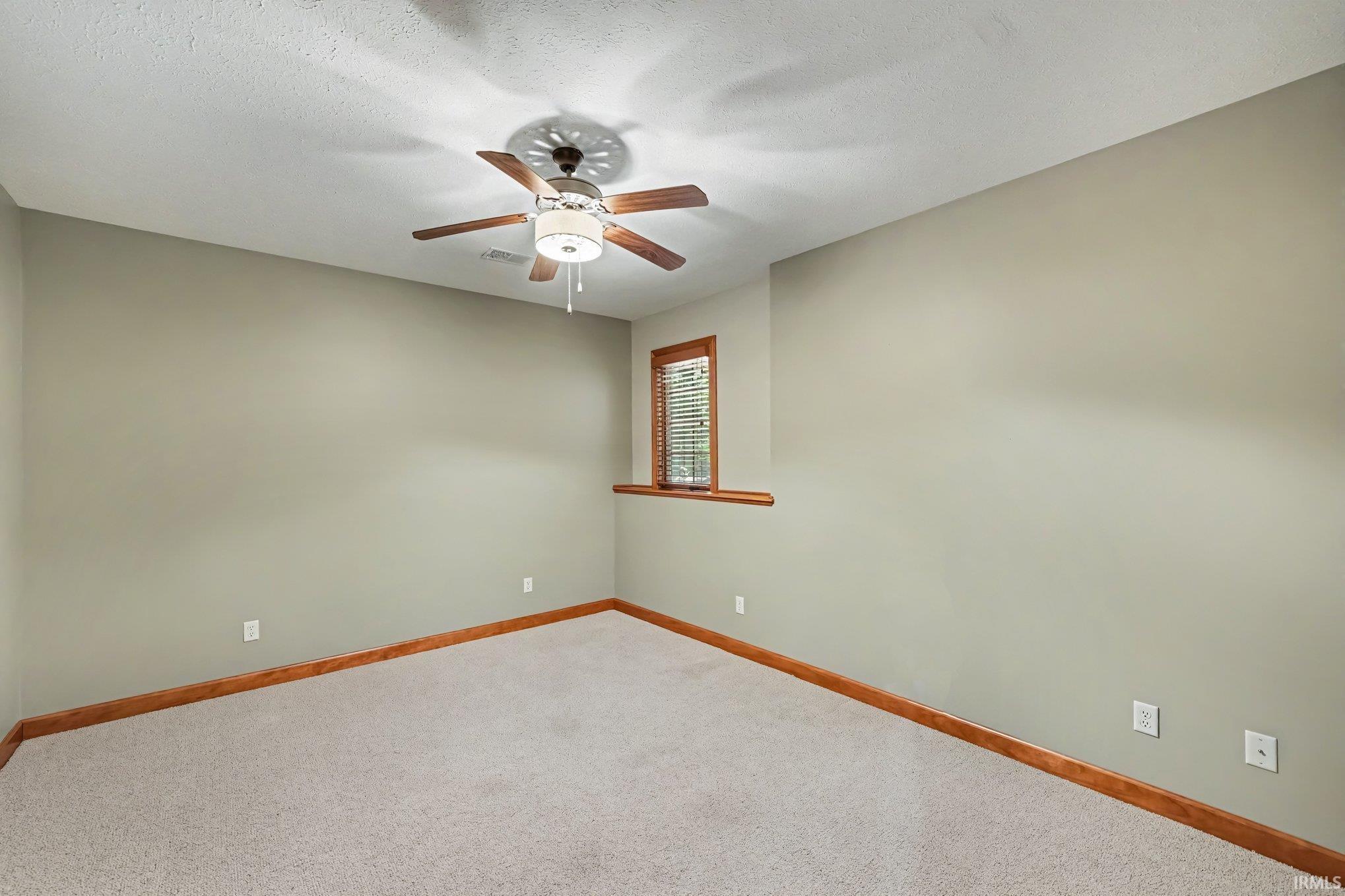 Bedroom 3 featuring carpeting, wood-trim border detail, recessed lighting, and a ceiling fan with integrated light fixture