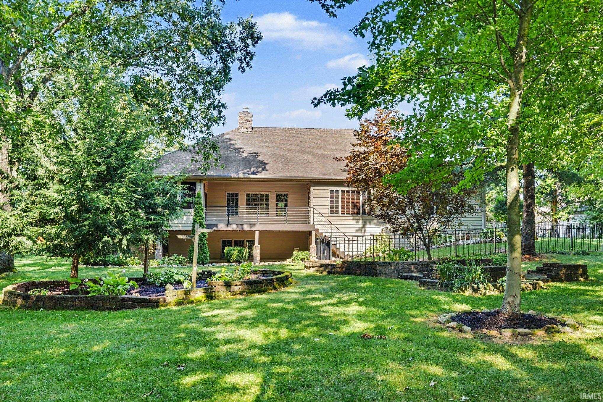 Charming two-story residence with a classic exterior featuring horizontal siding and a pitched roof