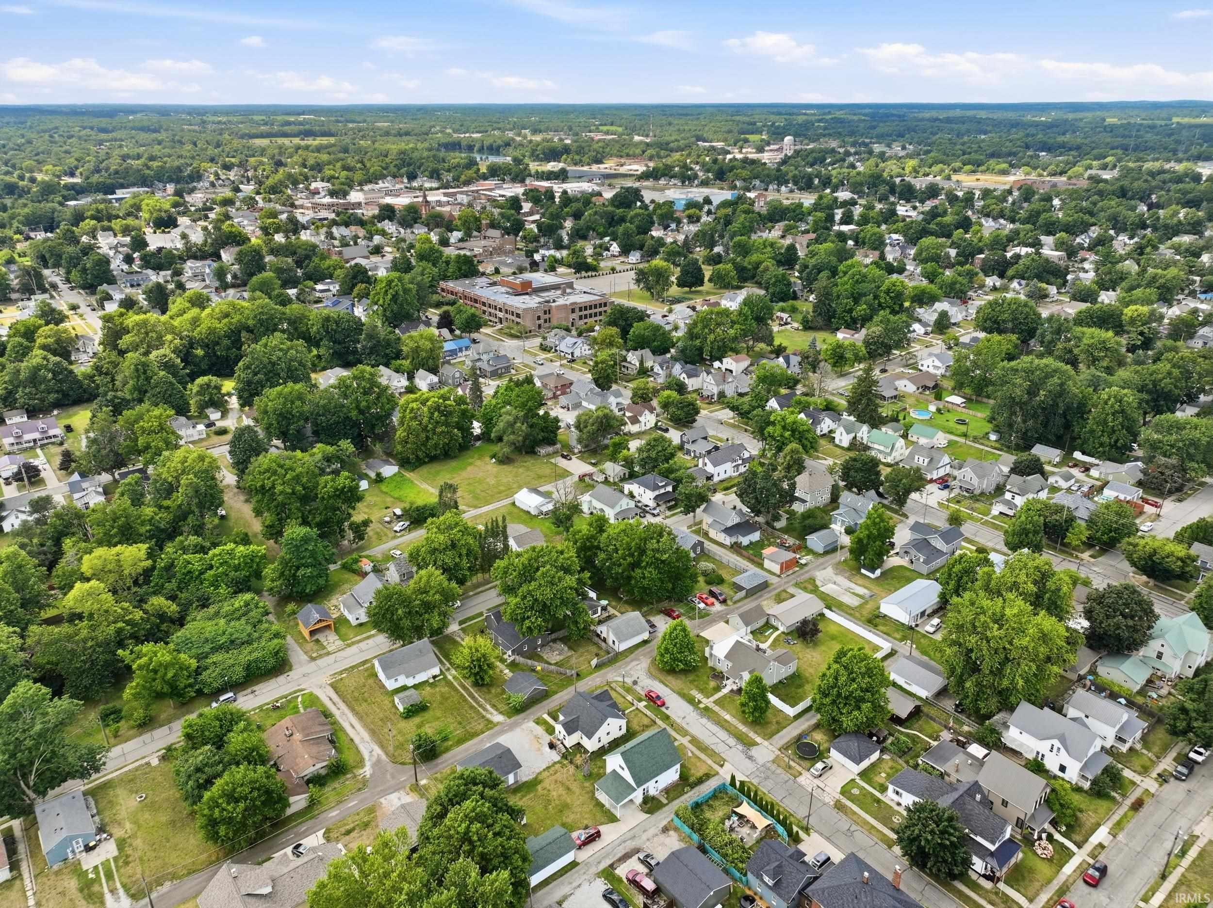 Expansive aerial perspective showcasing a residential area characterized by numerous single-family homes