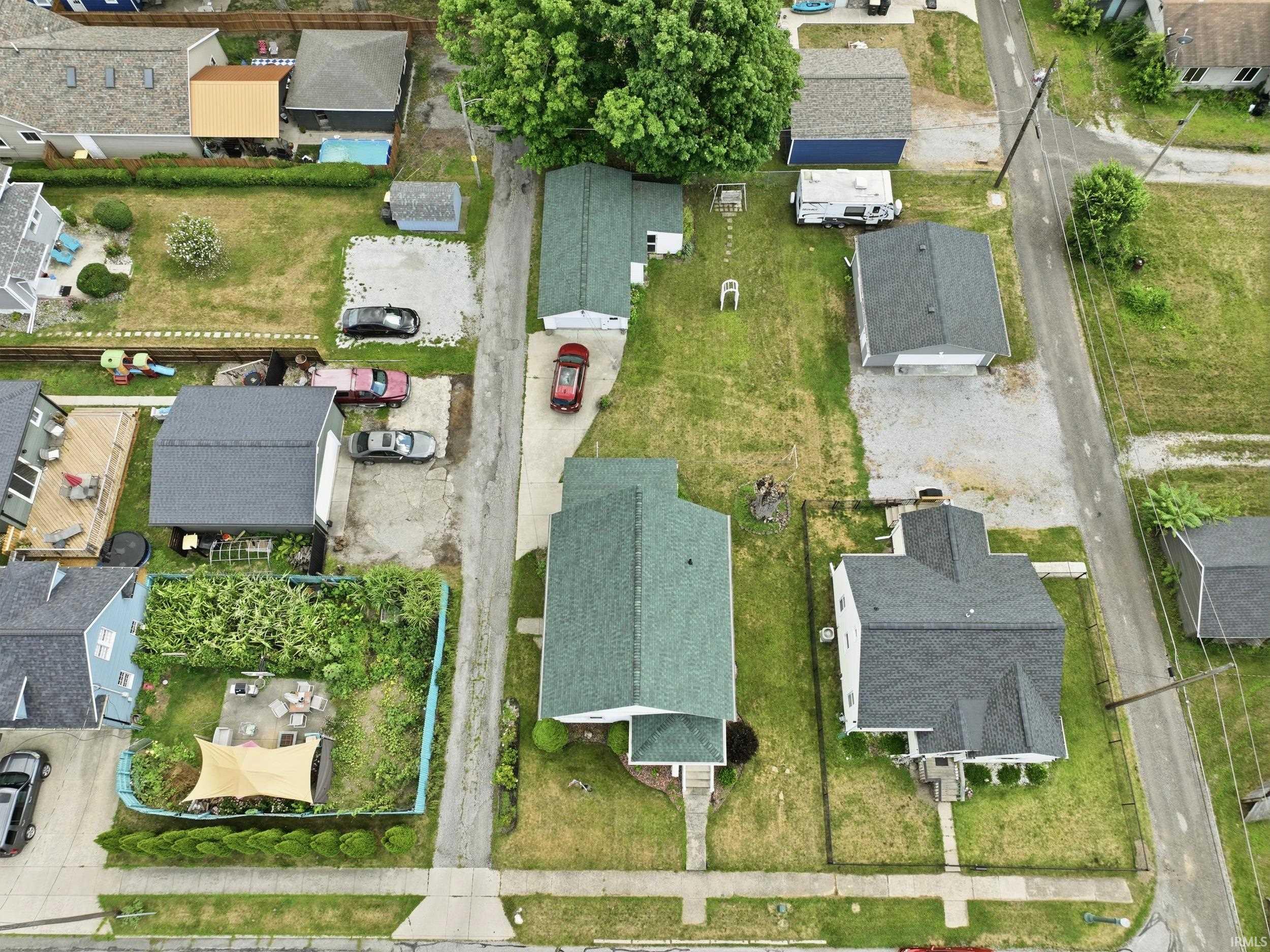 Overhead perspective of a residential area showcasing multiple properties