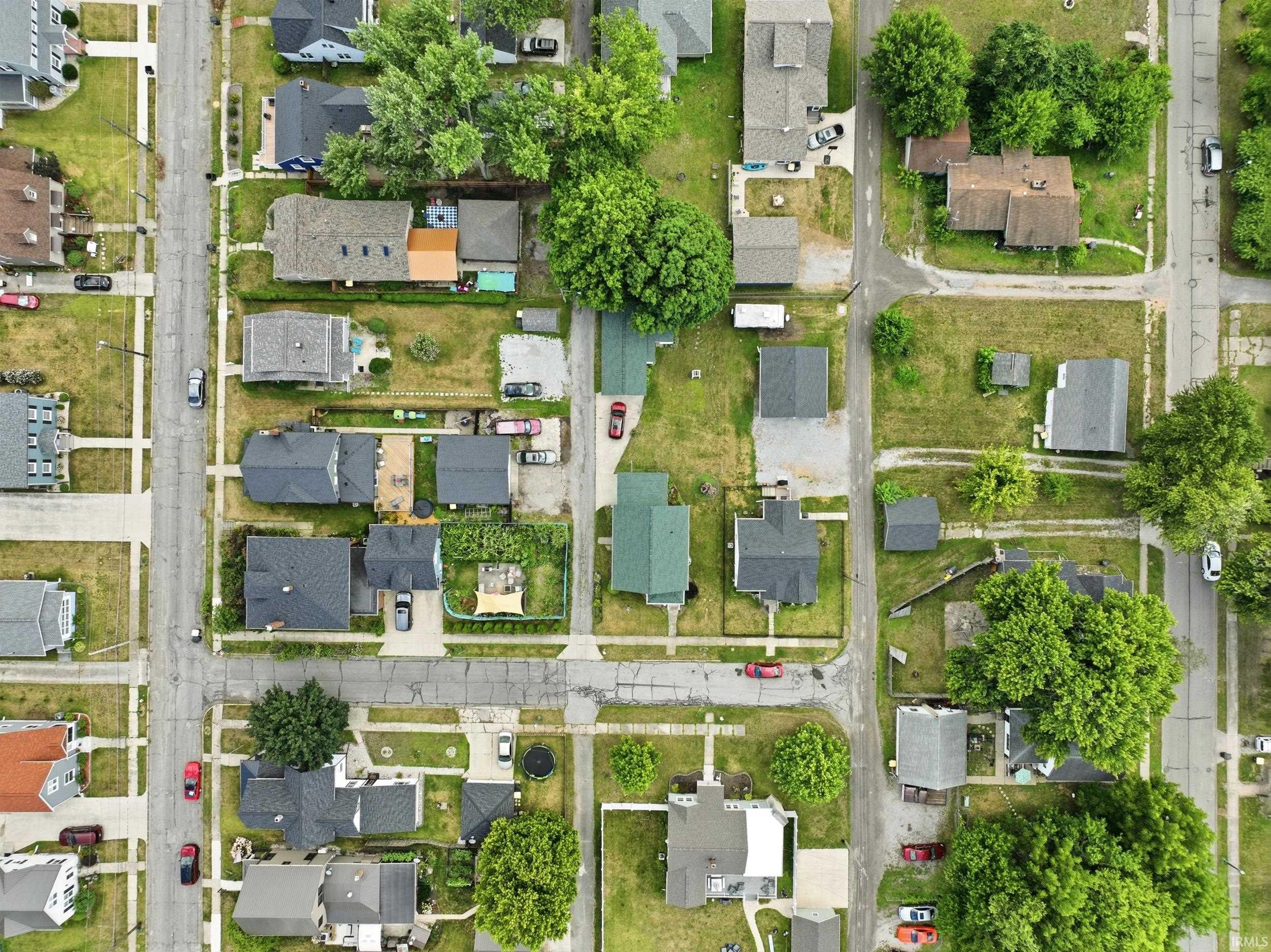 Aerial view displaying a residential neighborhood with a grid street layout