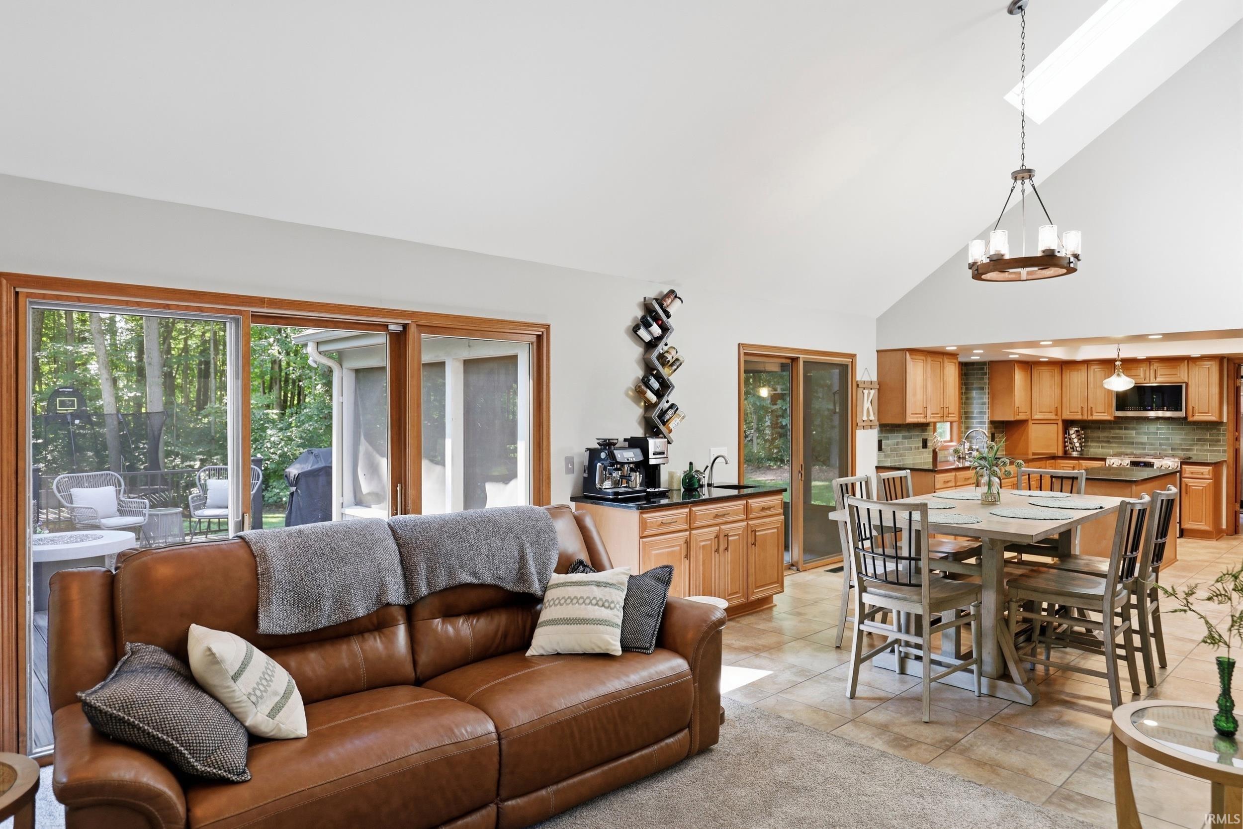 Vaulted ceiling with skylight and contemporary chandelier