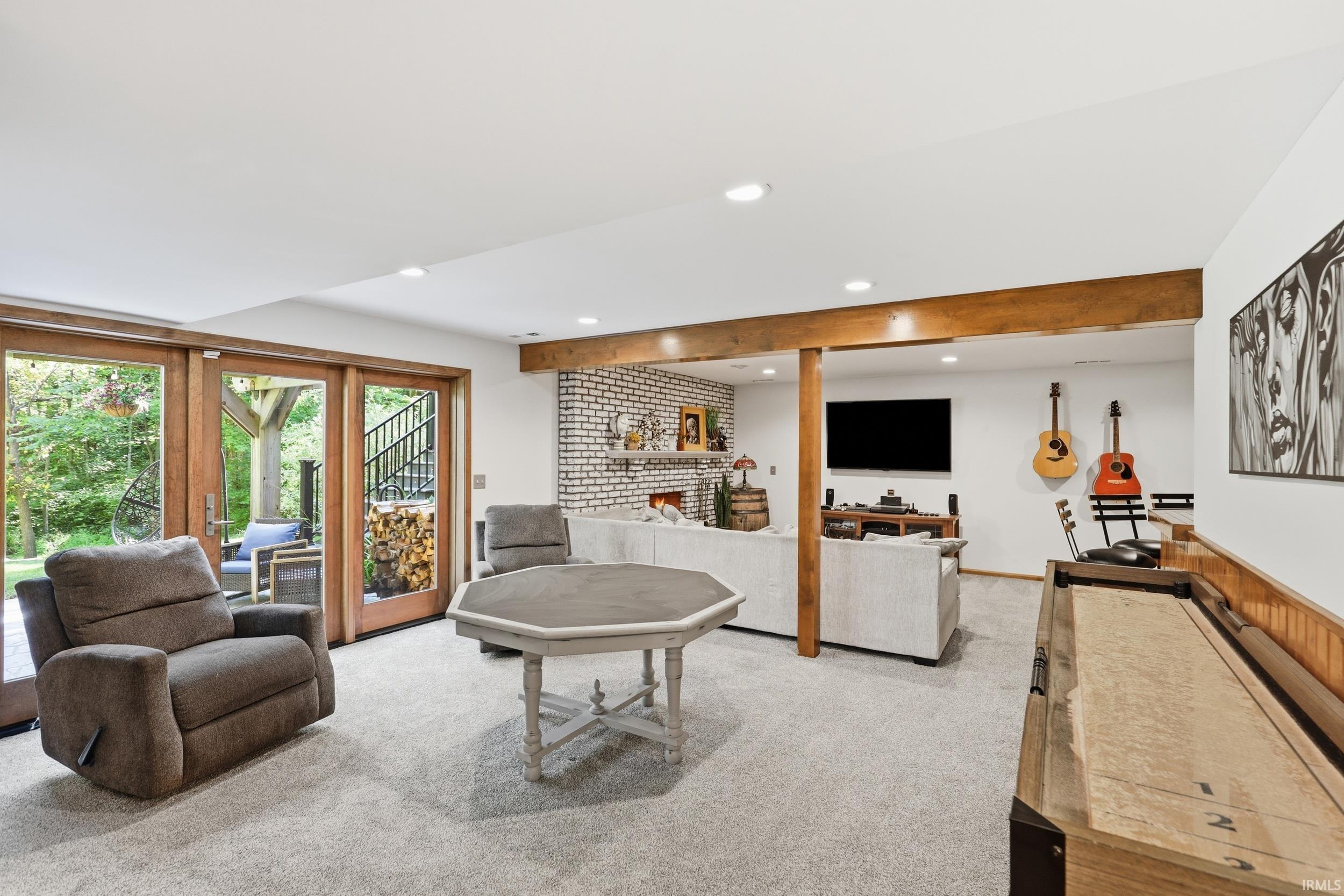 Finished lower level featuring light-toned carpeting and recessed lighting