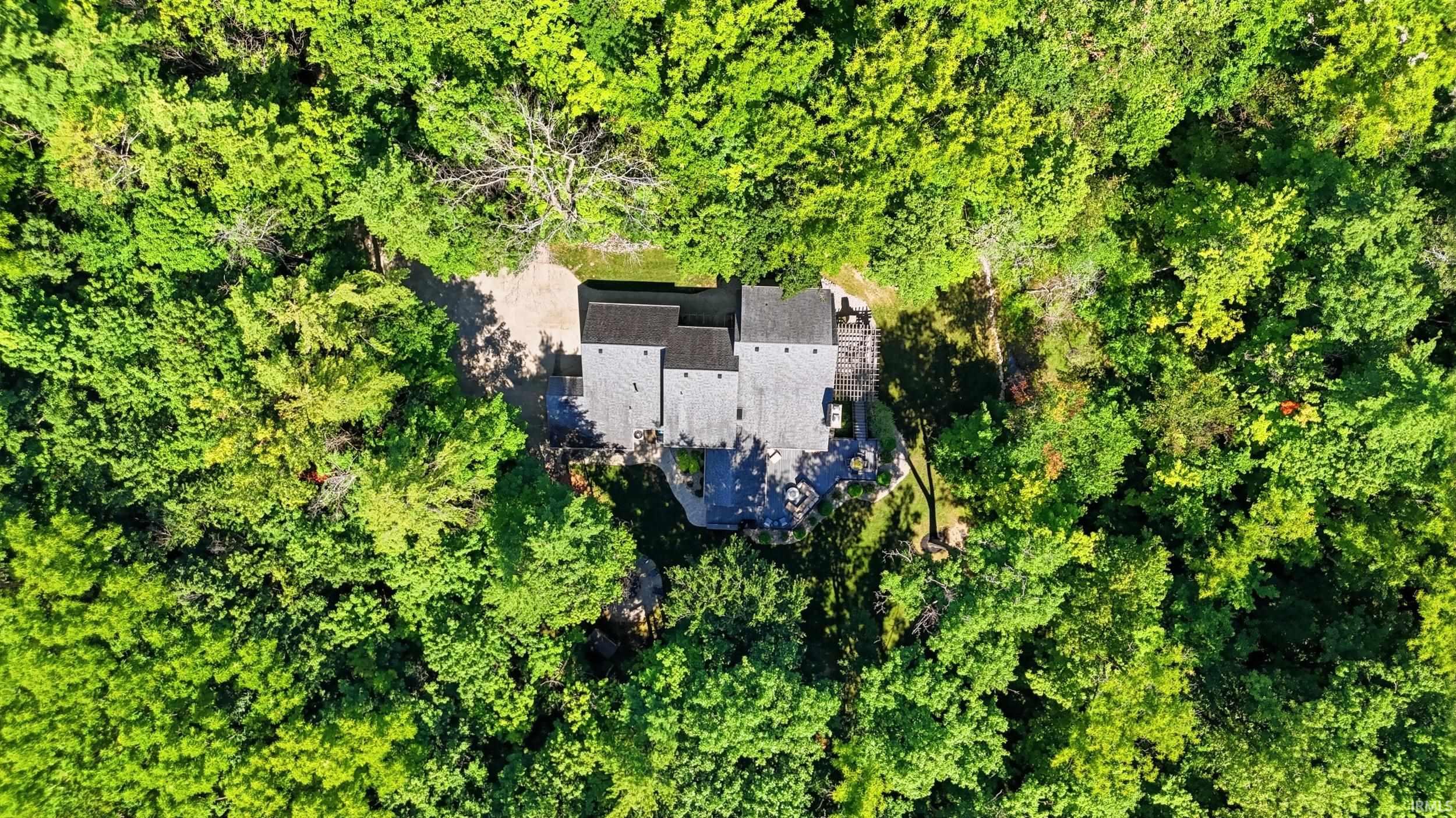 Property surrounded by dense, mature tree canopy