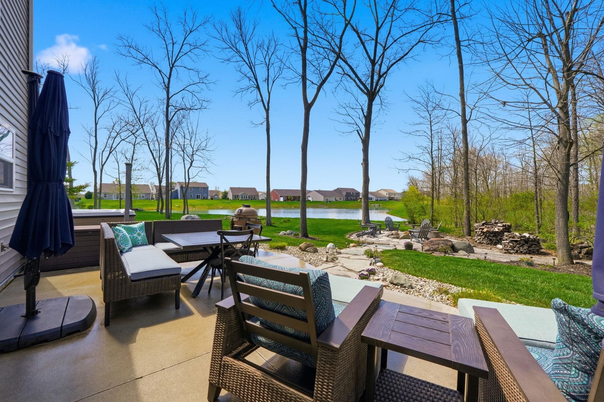 View of patio / terrace with outdoor dining area and a water view.