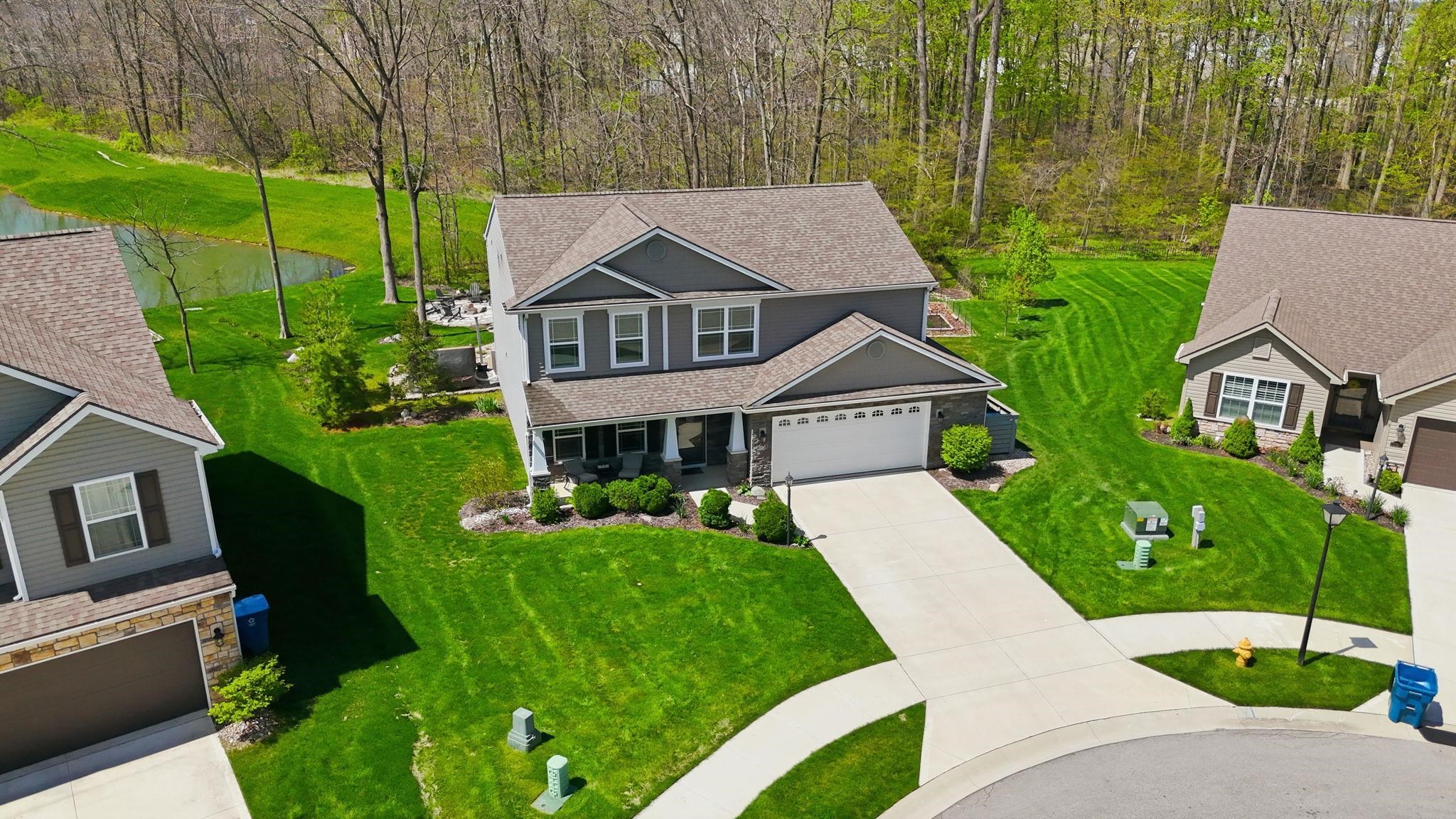 Two-story residence featuring gray siding and white trim