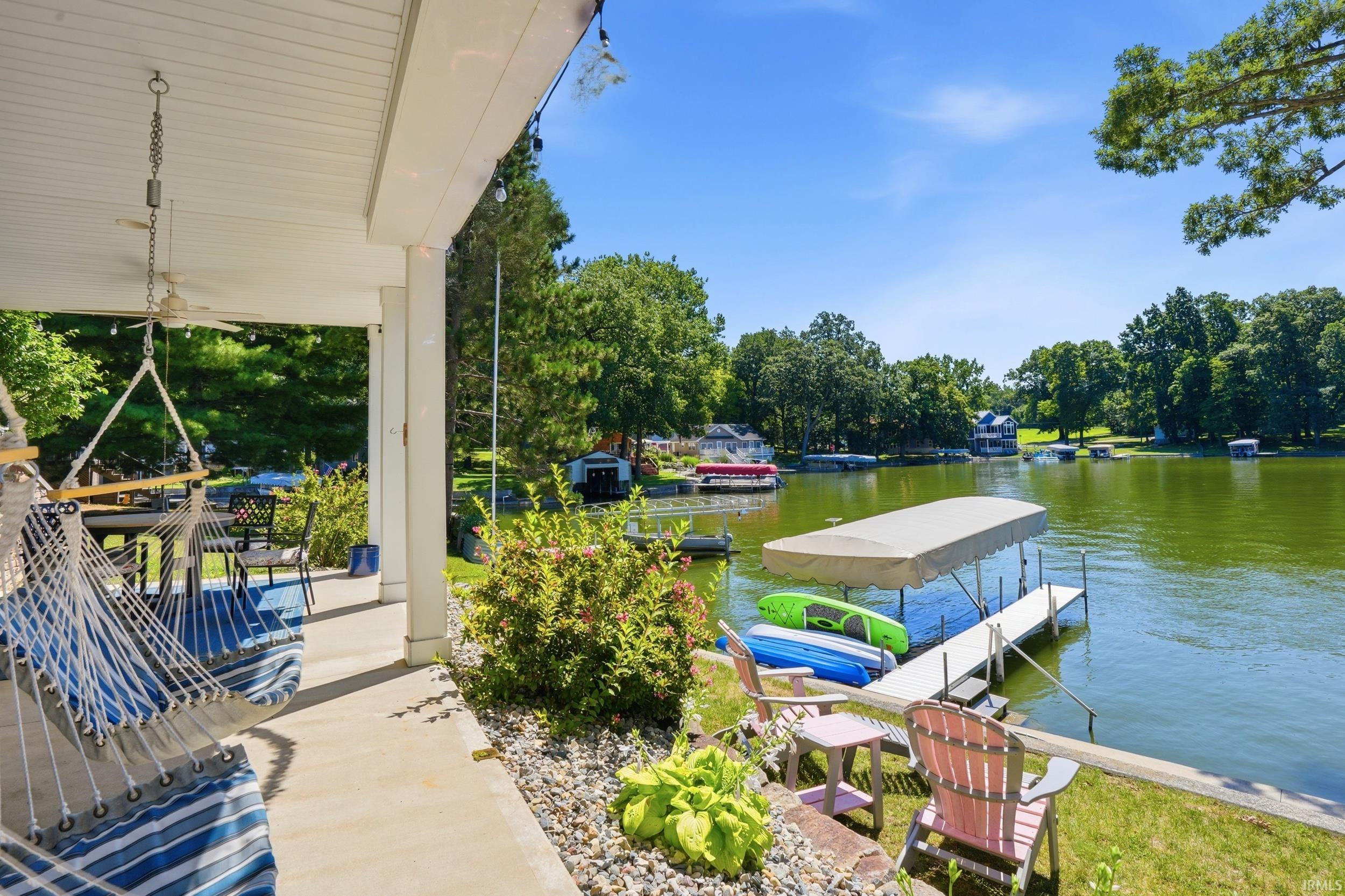Waterfront living with private boat dock and covered patio
