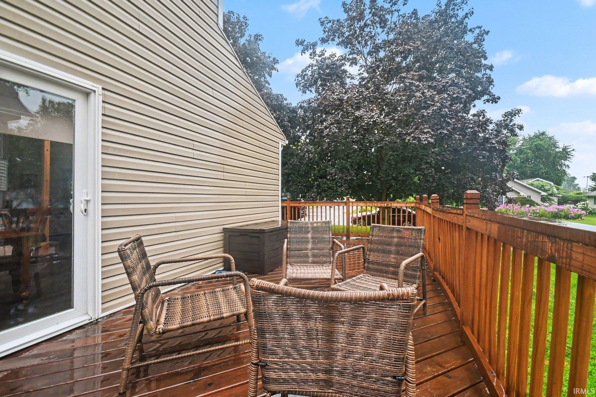 Expansive wood deck with a full wooden railing