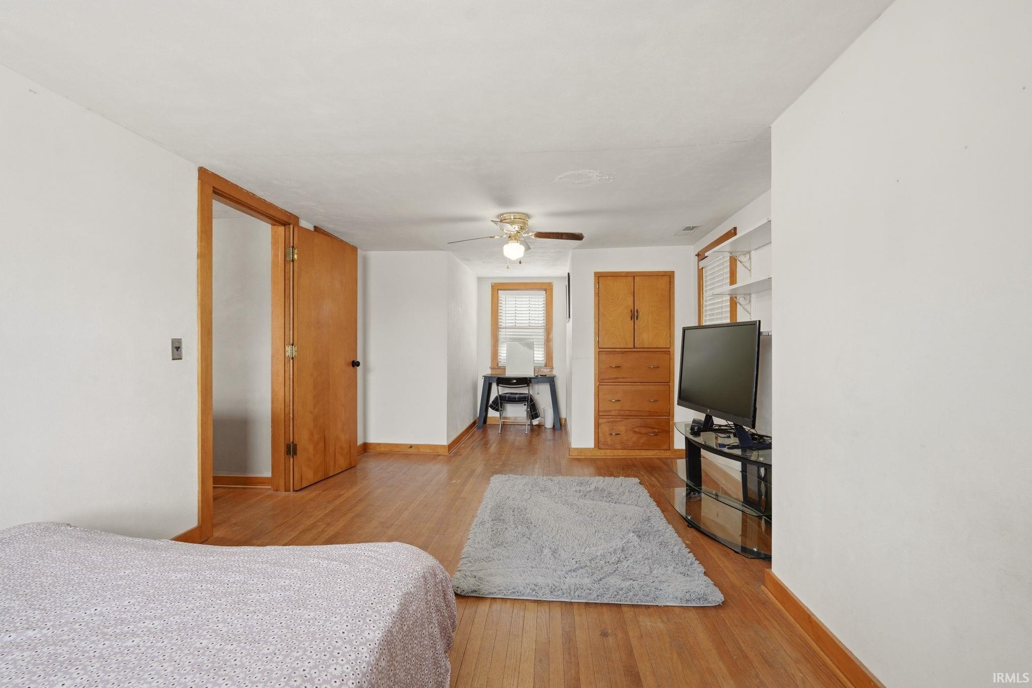 Hardwood flooring extending throughout, featuring a natural wood finish