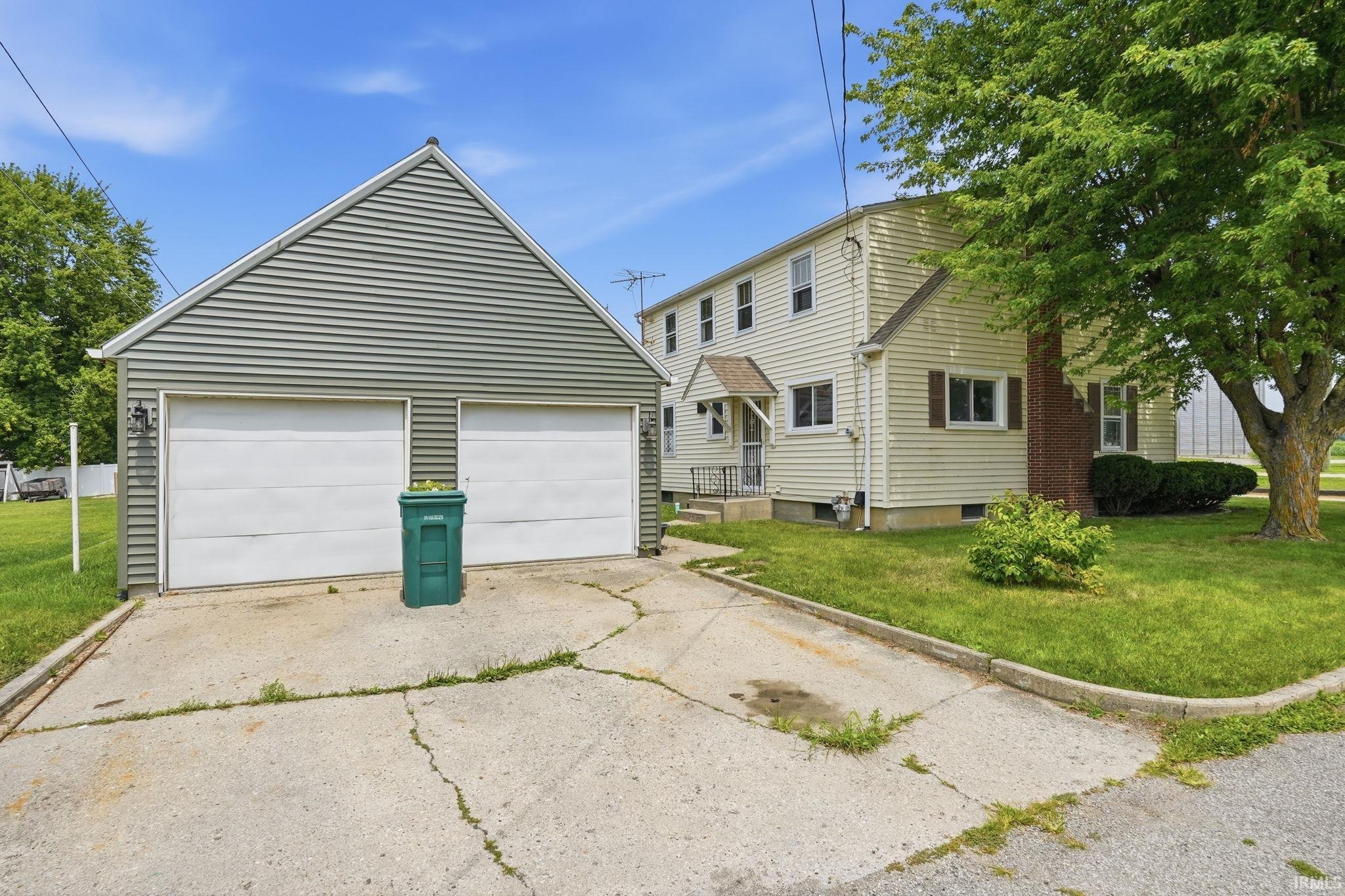Detached two-car garage with horizontal siding