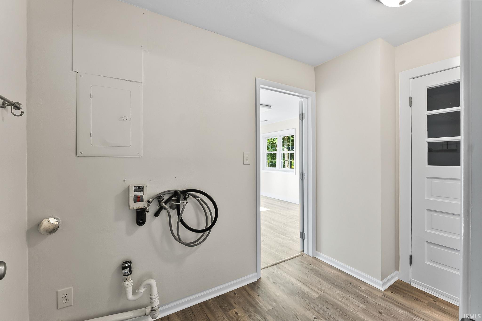 Wood-finish flooring with light neutral wall paint