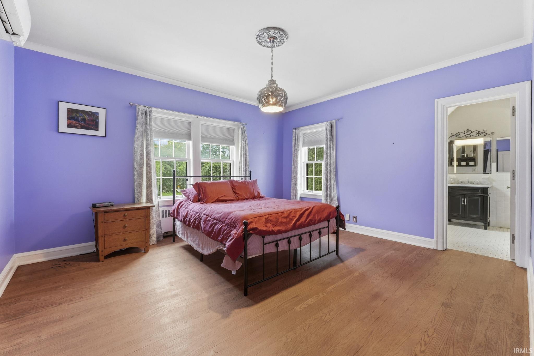 Hardwood-style flooring throughout with crown molding