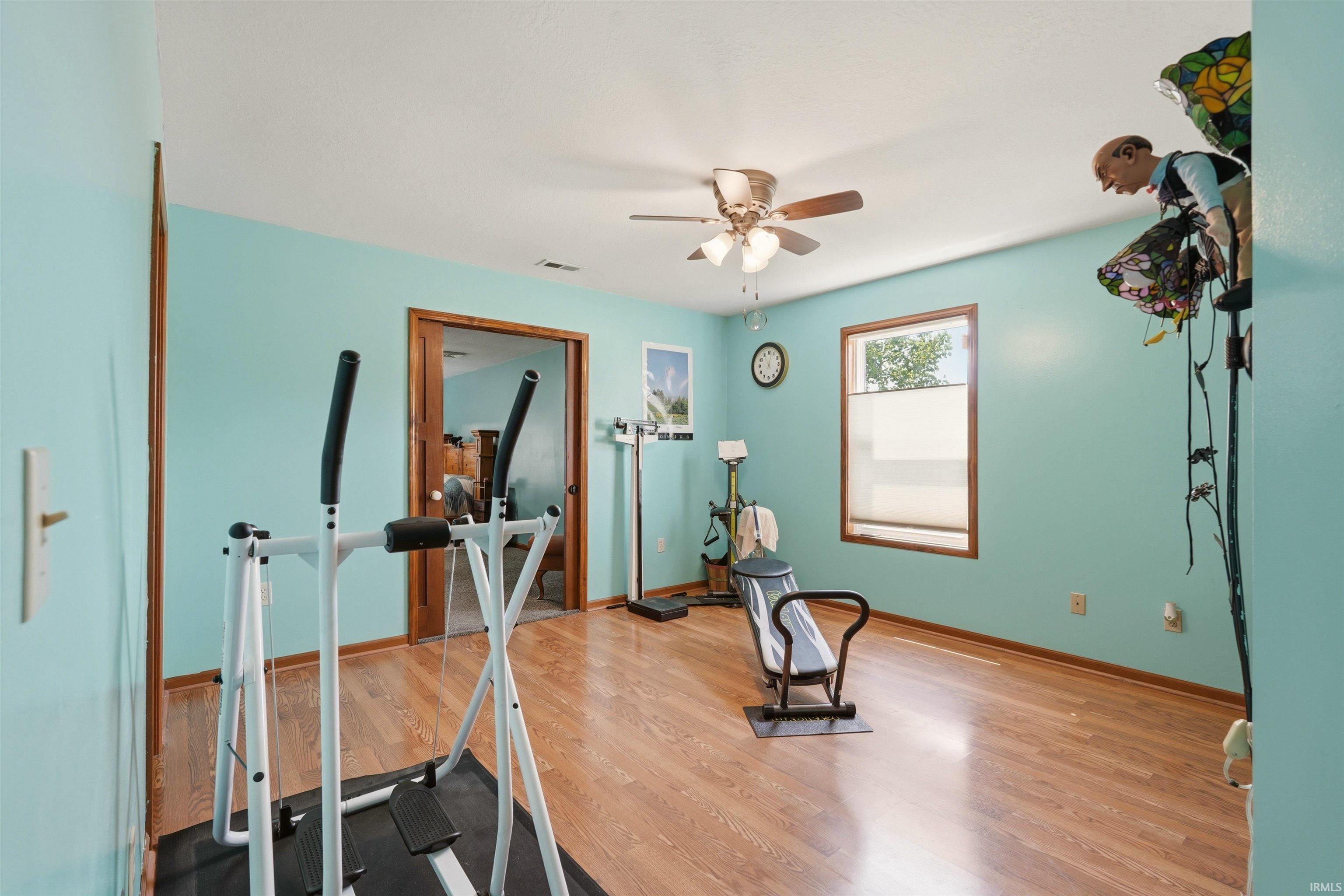Wood-finish flooring with a light blue wall finish